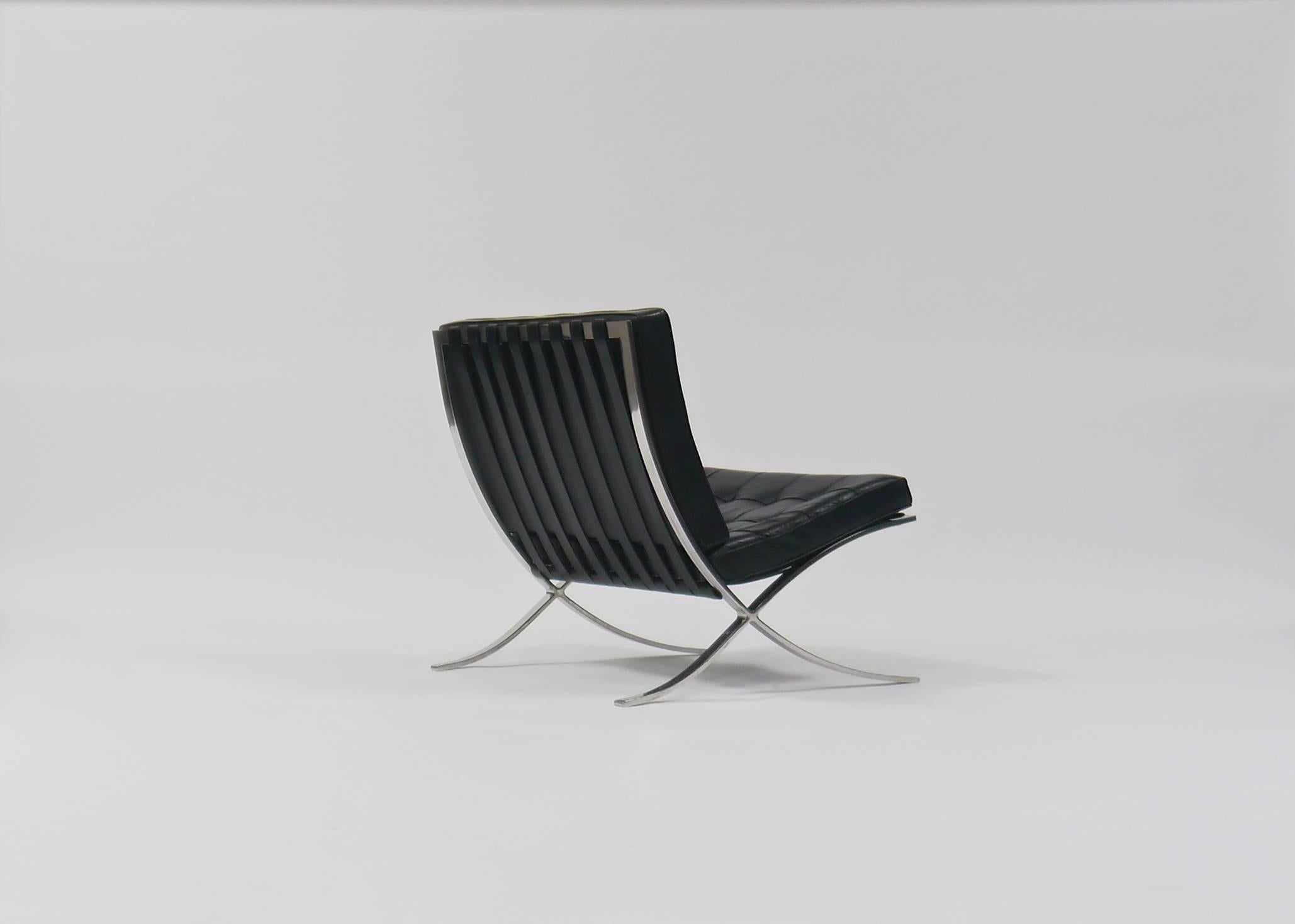Pair of Barcelona chairs by Mies Van Der Rohe for Knoll. Stainless steel and black leather, circa 1975.