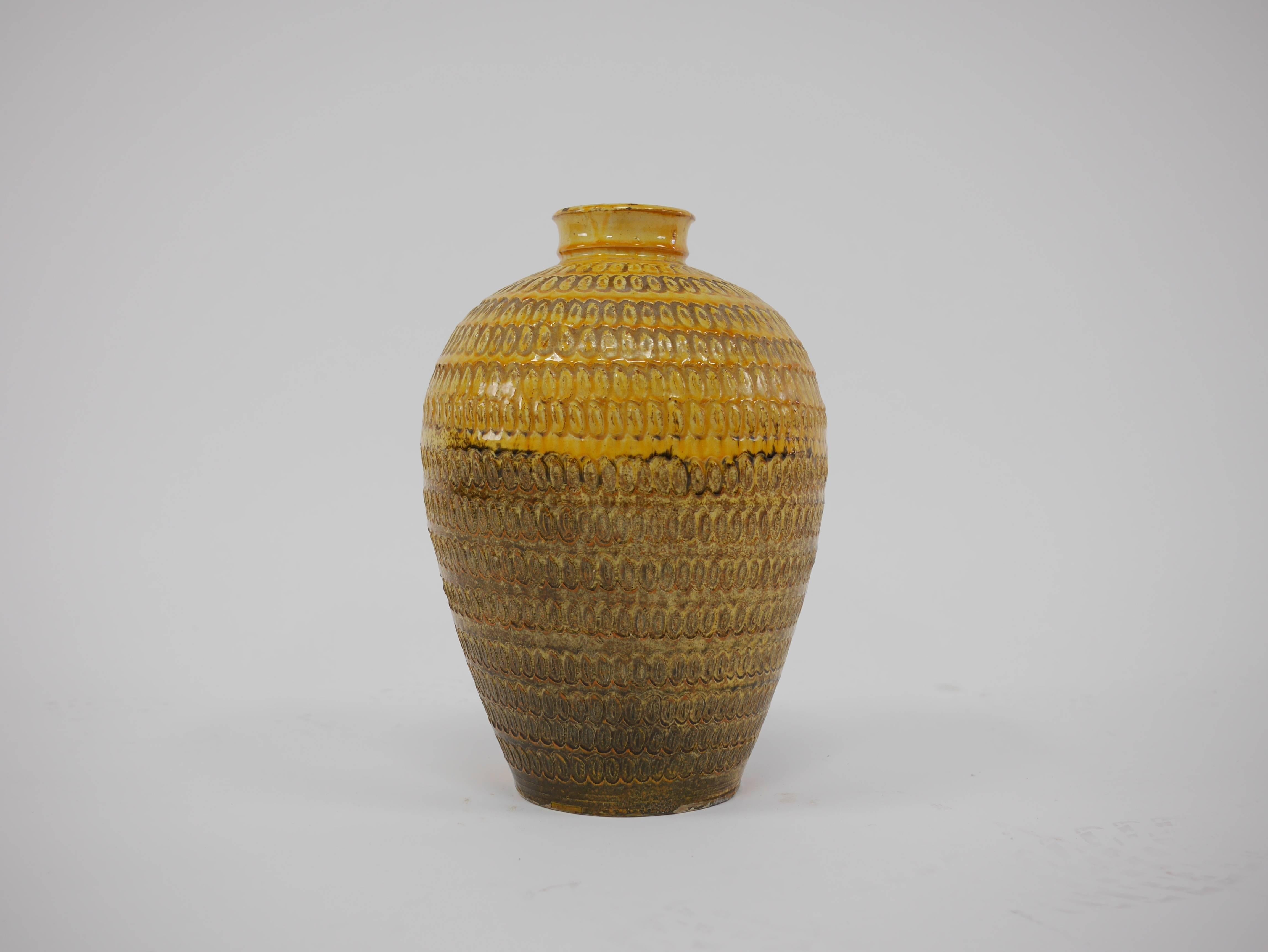 Very large stoneware vase with impressed decoration to body, yellow and brown glaze, 1930s-1940s.

15.5