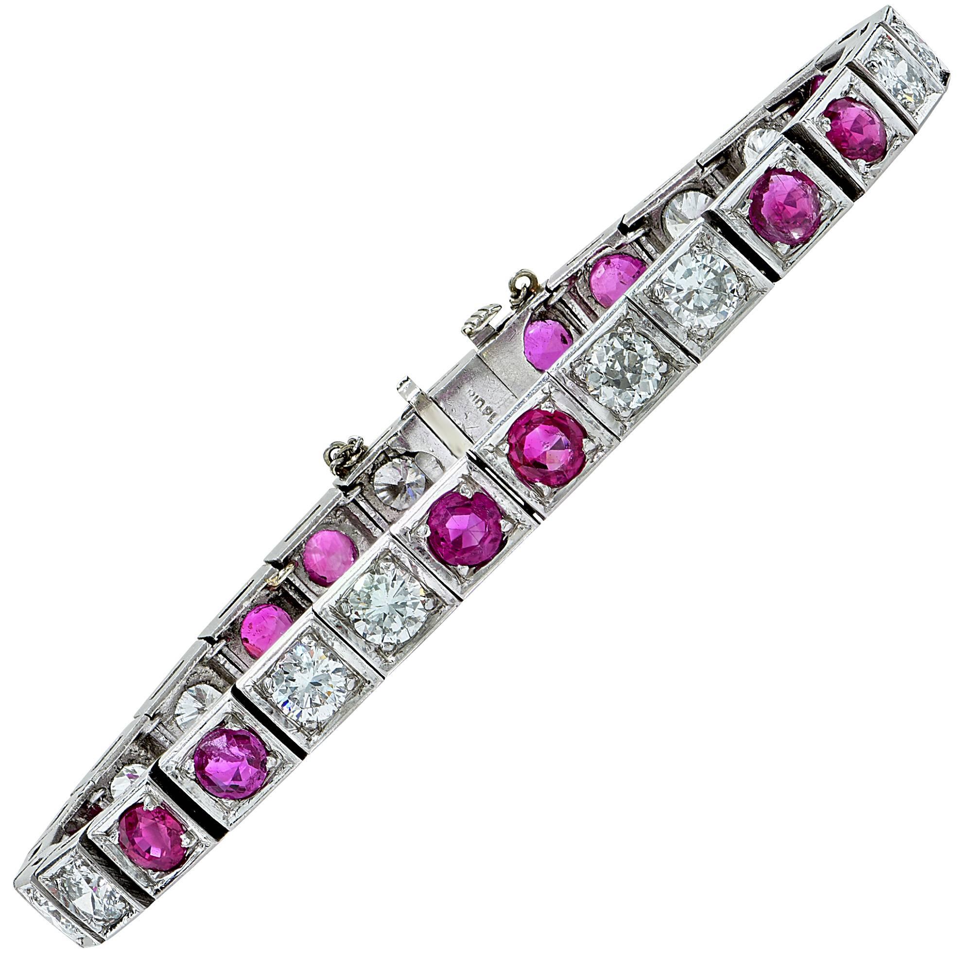 Stunning platinum bracelet featuring 14 round cut Burma rubies weighing approximately 6cts and 14 round brilliant cut diamonds weighing approximately 5cts G color and VS-SI clarity.

The bracelet measures 7 inches in length by .24 inch in width by