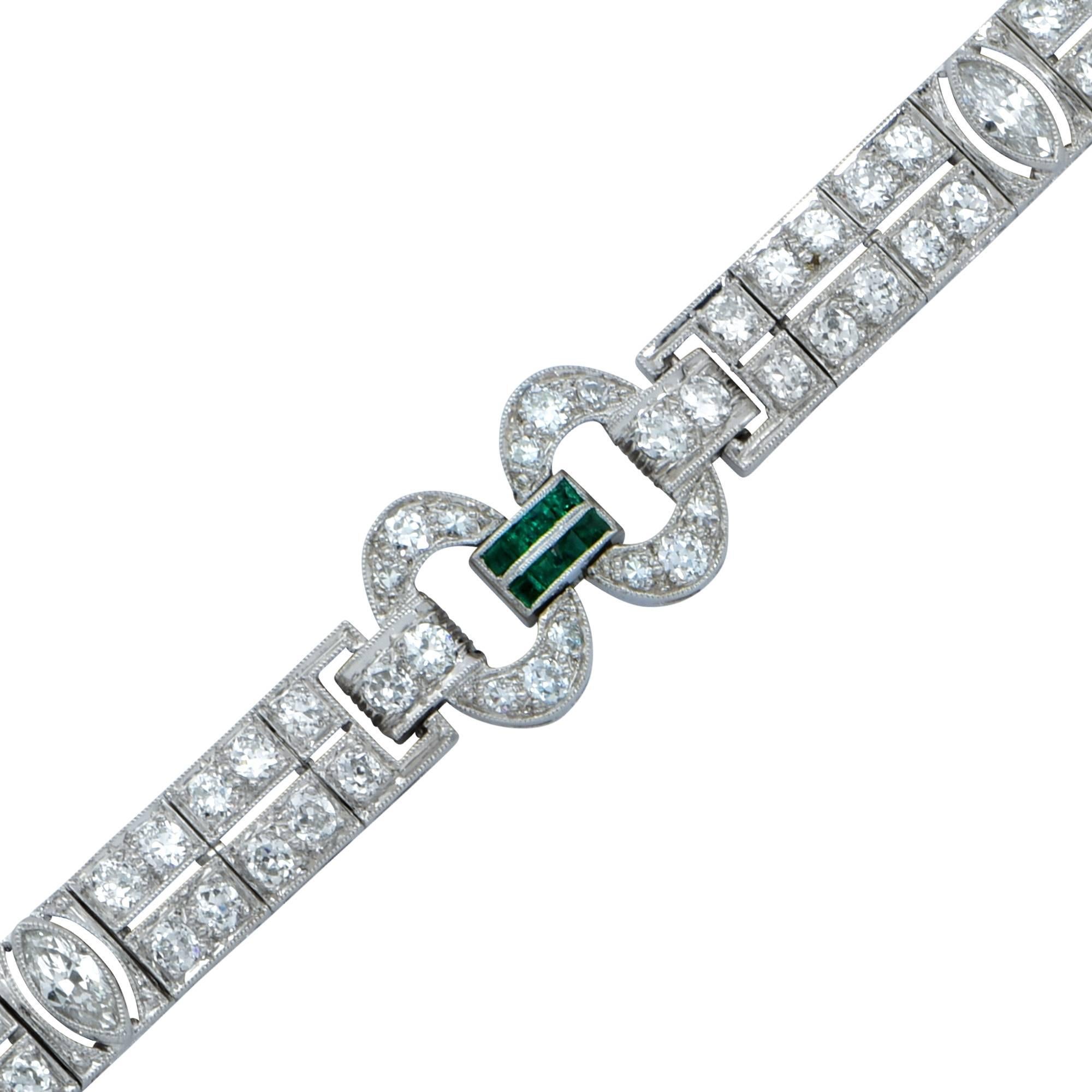Platinum Art Deco bracelet featuring 3 marquise cut diamonds weighing .60cts total and 109 European cut and single cut diamonds weighing 4.40cts total G-H color VS clarity. The total diamond weight is approximately 5cts and this bracelet weighs 22.8