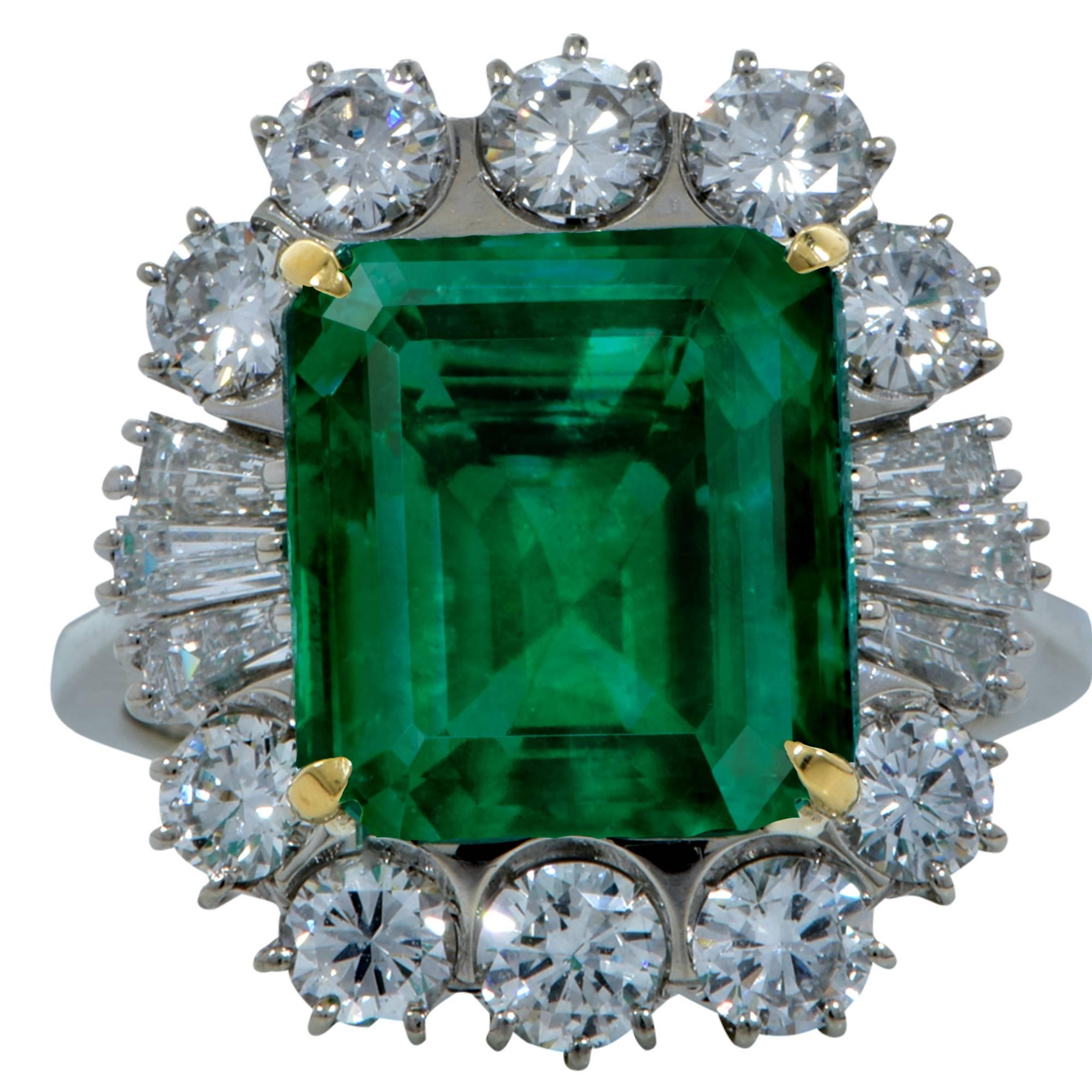 This 18k White gold ring showcases a spectacular emerald cut emerald weighing 6.59cts that is certified by the GIA with a Colombian provenance. The emerald has a very vibrant verdant green presence, sought after by many emerald connoisseurs.