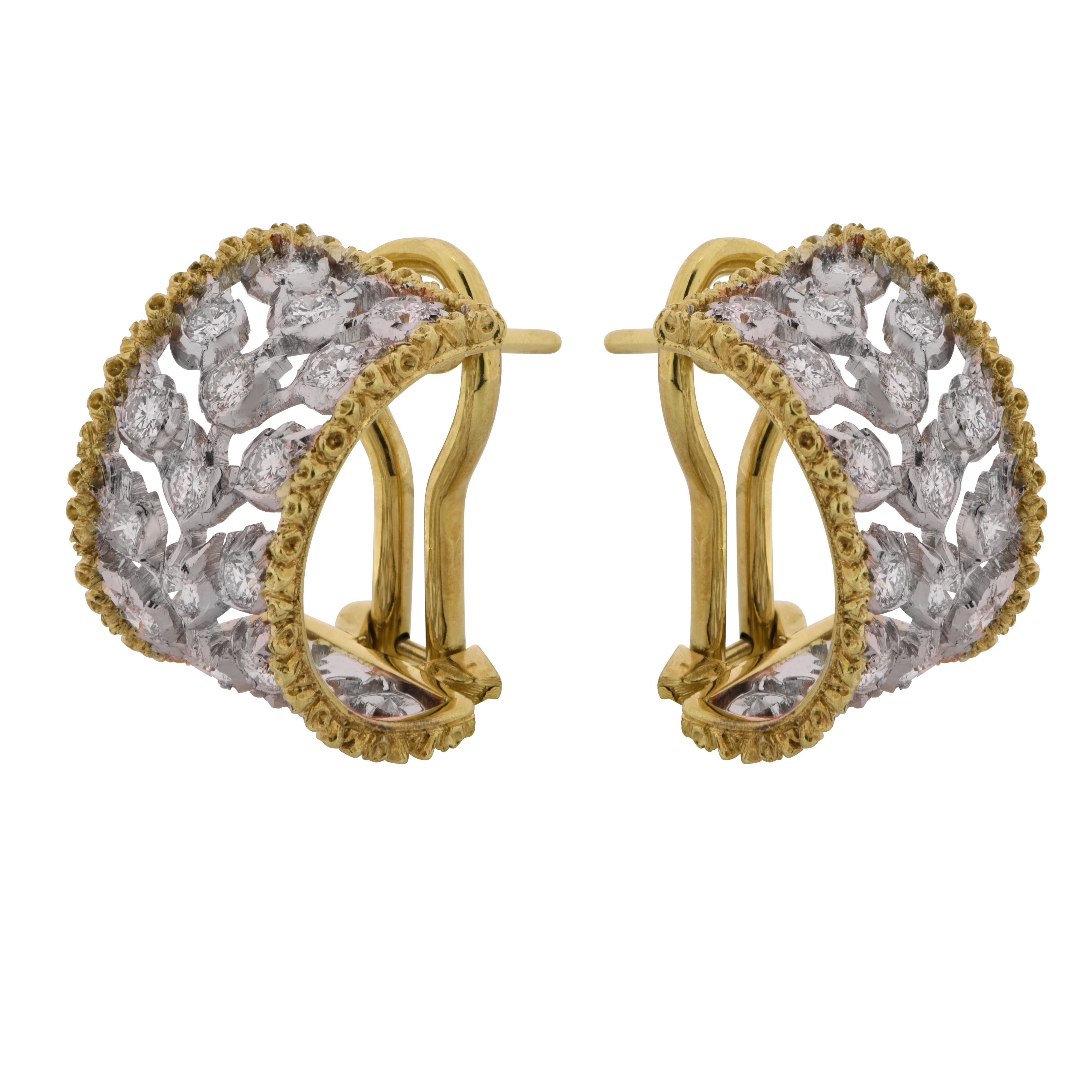 Spectacular three row diamond huggie earrings from the Ramage Collection by Buccellati, crafted in 18 Karat white and yellow gold, featuring forty round brilliant cut diamonds weighing approximately  .80 carats, E-F color, VVS clarity. These