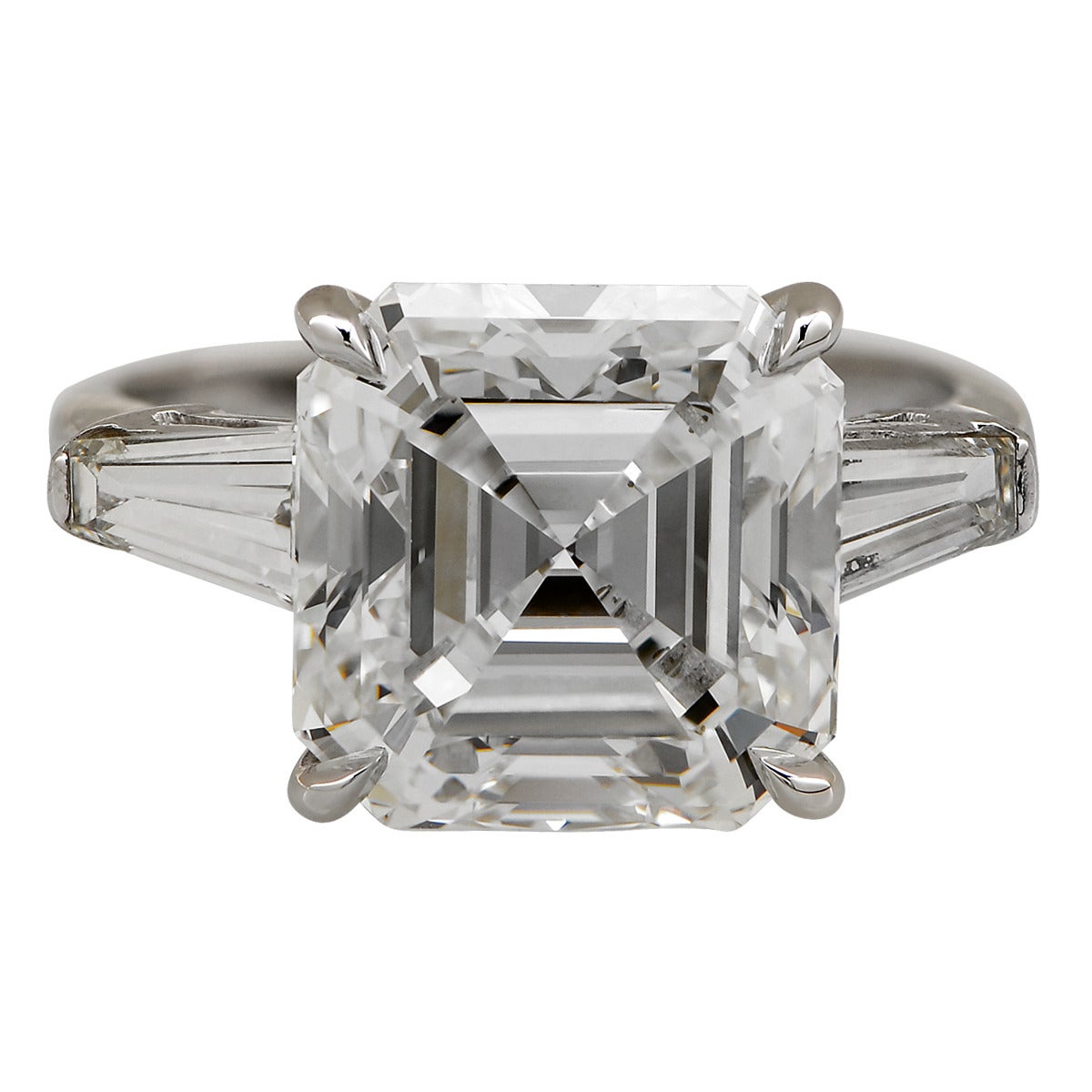 This gorgeous 7.15ct square emerald cut, I color, VS1 clarity, GIA graded diamond is flanked by 2 emerald cut diamonds weighing approximately 1.40cts, H color, VS clarity, and is set in an Aletto signed platinum ring.

Ring size: 4.5
Metal