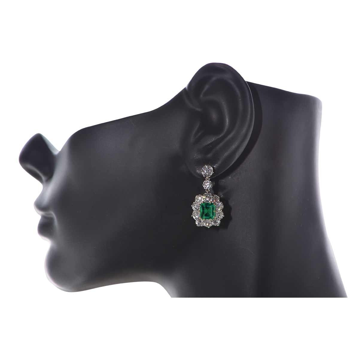 Platinum and 18KT Yellow Gold Earrings Featuring 2 Colombian Emeralds Weighing 3.04cts Total, Accented by 6.17cts of Old European Cut Diamonds G Color, VS-SI Clarity.