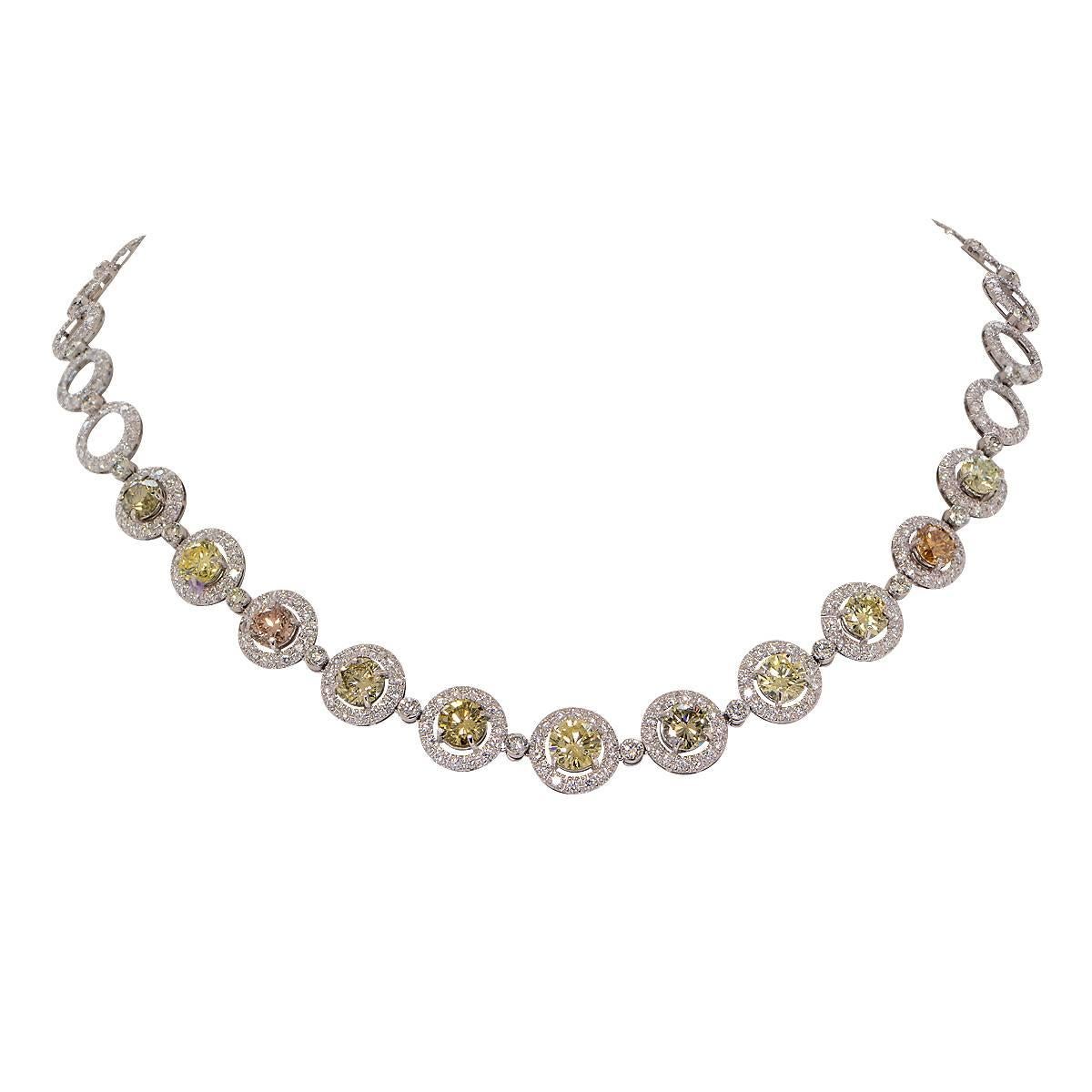 Magnificent platinum necklace composed of 4 GIA graded natural fancy yellow and brown round brilliant cut diamonds weighing 4.77cts with 7 round brilliant cut natural fancy brown and yellow diamonds weighing 7.87cts surrounded with 13.39cts of white