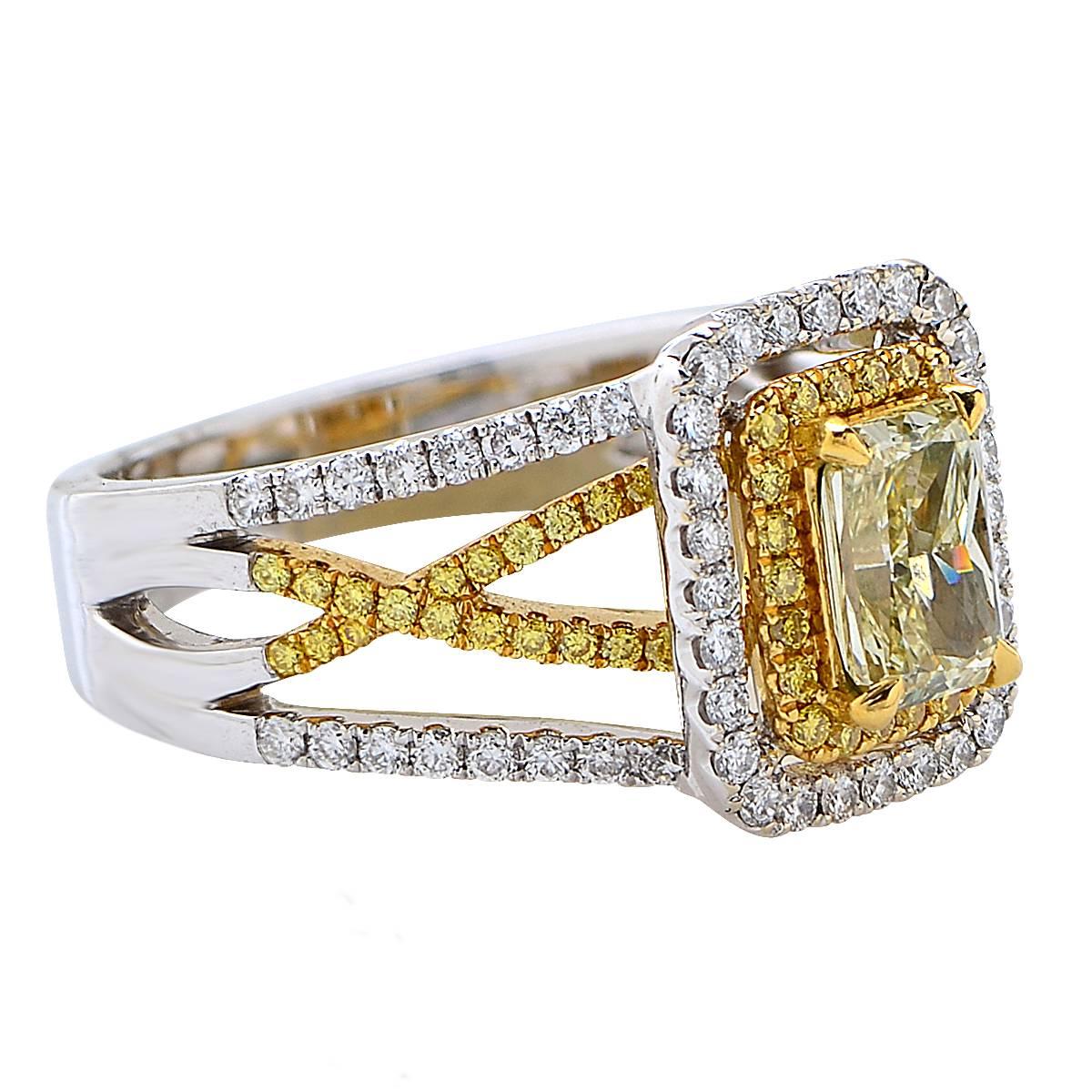 Stunning ring crafted in 18 Karat white and yellow gold, showcasing a GIA Certified radiant cut Fancy Yellow diamond weighing 1.11 carats, SI1 clarity, surrounded by 132 round brilliant cut Fancy Intense Yellow diamonds and white, G Color diamonds