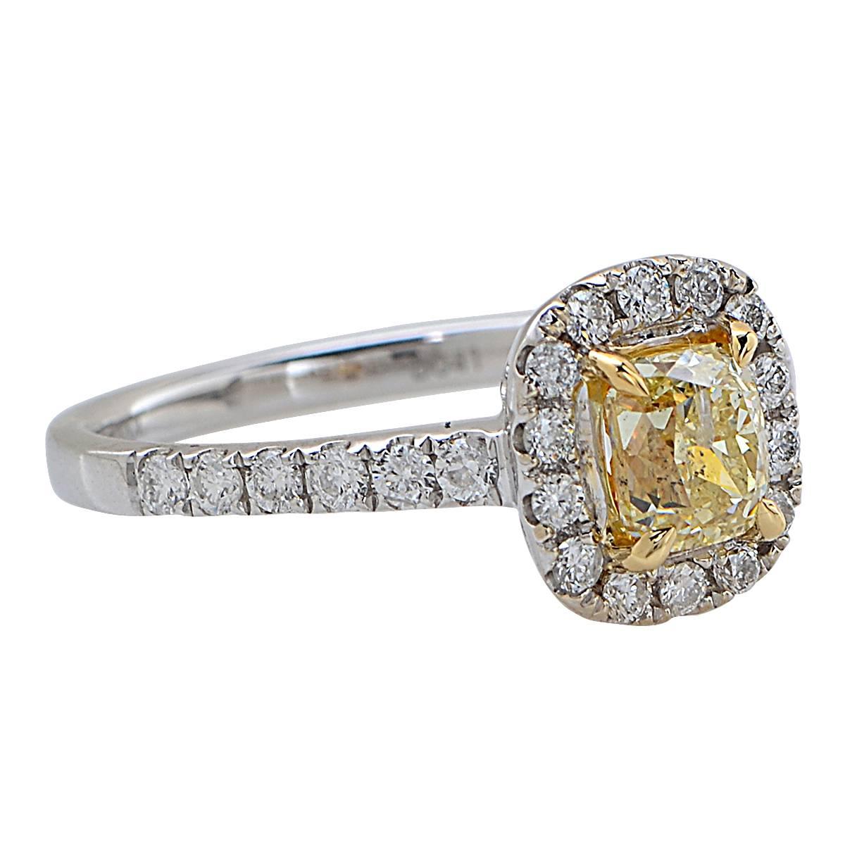 18 Karat White and Yellow Gold Ring Featuring a Natural Fancy Light Yellow GIA Graded Cushion Cut Diamond Weighing .90 Carats Accented by 26 Round Brilliant Cut Diamonds Weighing .41 Carats Total.