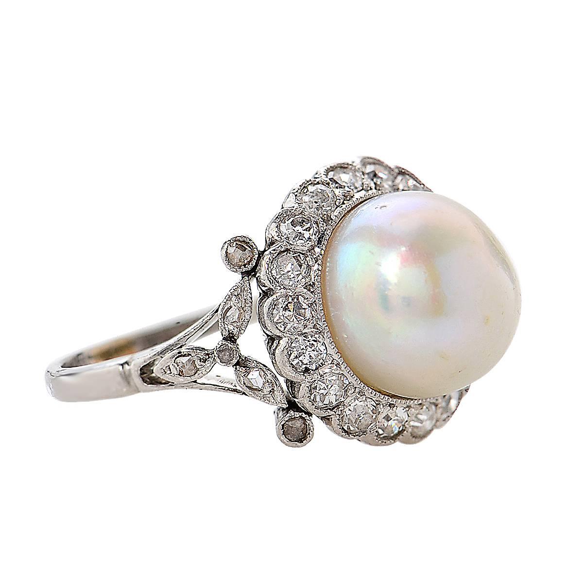 Beautiful Art Deco ring crafted in platinum, showcasing a GIA certified Fresh Water Natural Pearl measuring 9.6 mm in diameter surrounded by 29 Old European Cut diamonds weighing approximately .30 carats total. This spectacular ring is a size