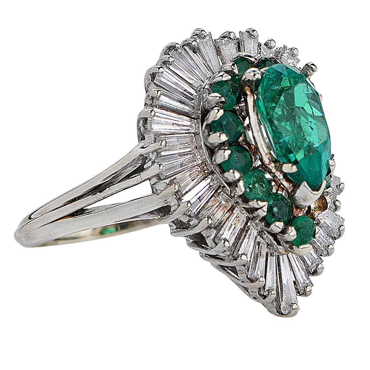Ballerina Ring Containing a 1.57 Carat Fine Colombian Emerald Surrounded by 13 Round Emeralds .85 Carats and 32 Baguette Cut Diamonds Approximately 2.50 Carats, G Color, VS Clarity. Ring Size is 5.5.
