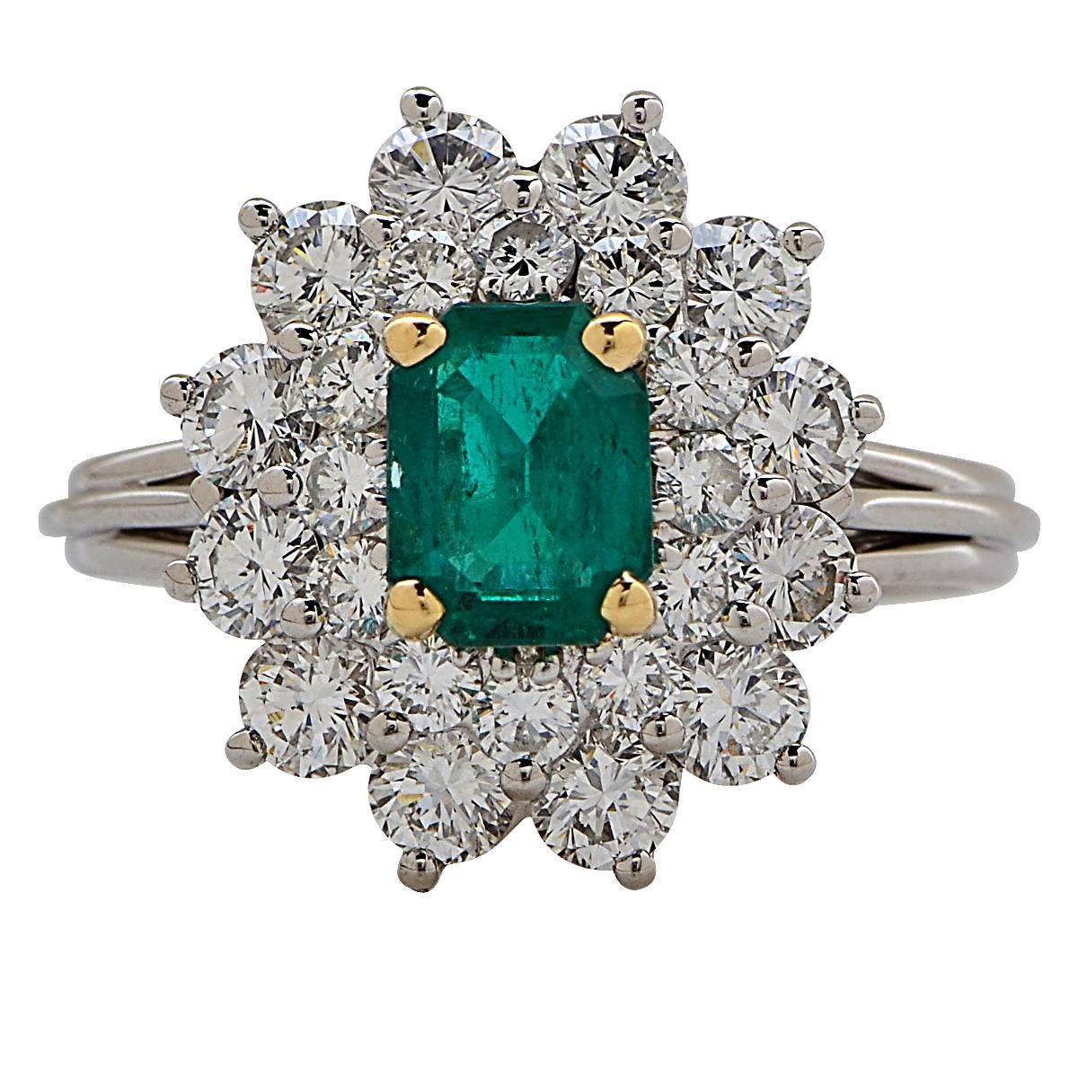 Platinum Ring Featuring a Colombian Emerald Weighing Approximately 1.10 Carats Accented by 24 Round Brilliant Cut Diamonds Weighing Approximately 2 Carats Total, F Color, VS Clarity.

Ring Size: 6.5