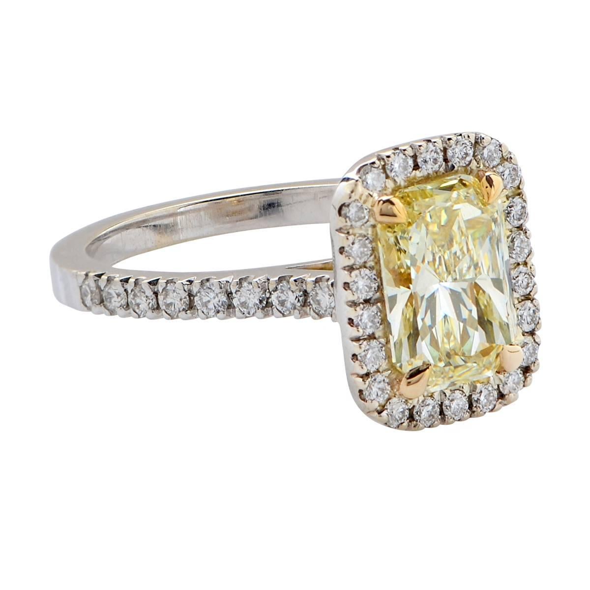 18 Karat White and Yellow Gold Custom-Made Ring Featuring a 1.71 Carat, U Color, SI1 Clarity, Radiant Cut Diamond Accented by 38 Round Brilliant Cut Diamonds Weighing .41 Carats Total, G Color, VS Clarity.