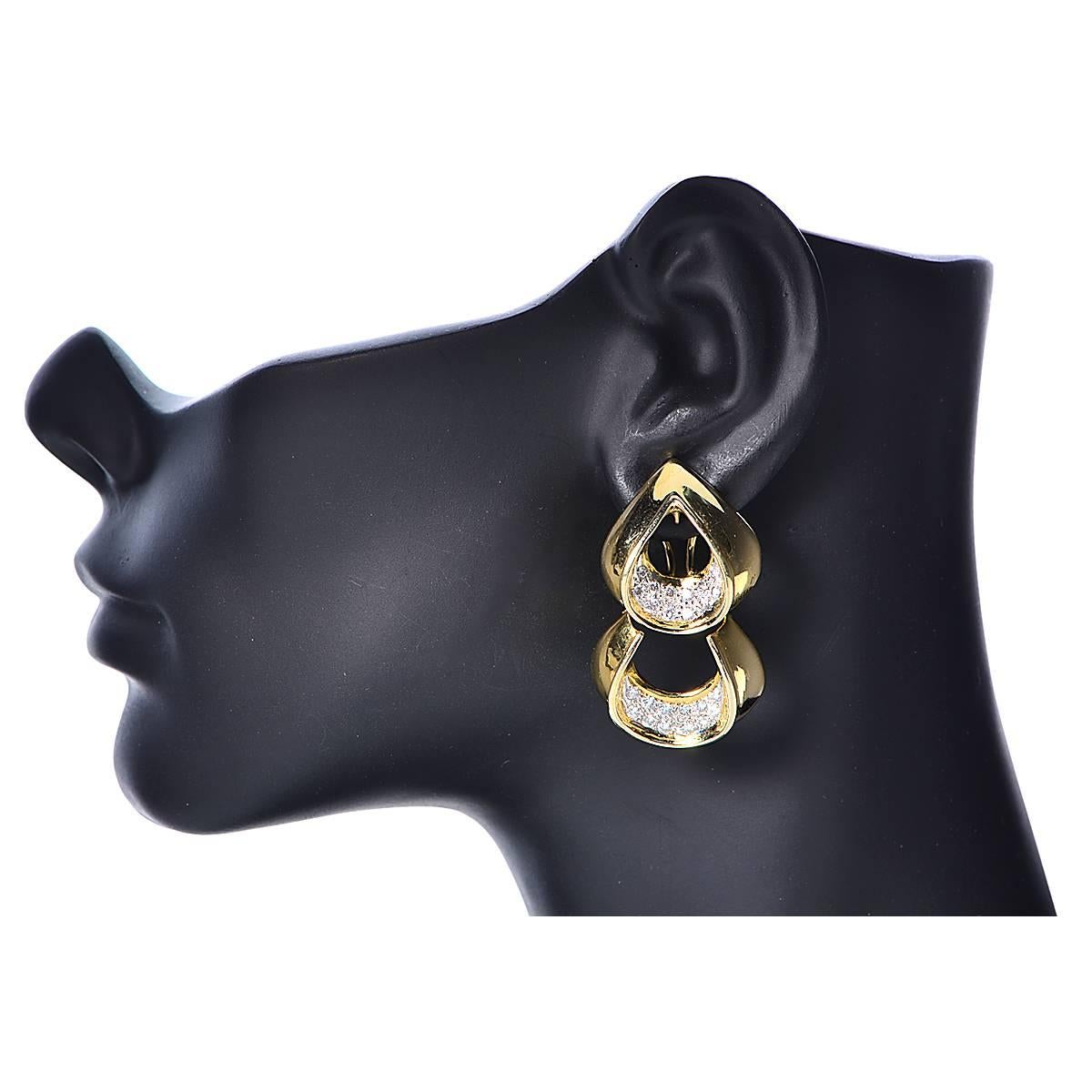 18k yellow gold earrings featuring 48 round brilliant cut diamonds weighing approximately 2cts, F color, VS1 clarity.

The earrings measure 1.75 inches in length by 1.25 inches in width by 11/16 inch in depth.
They weigh 22.15 grams

These beautiful