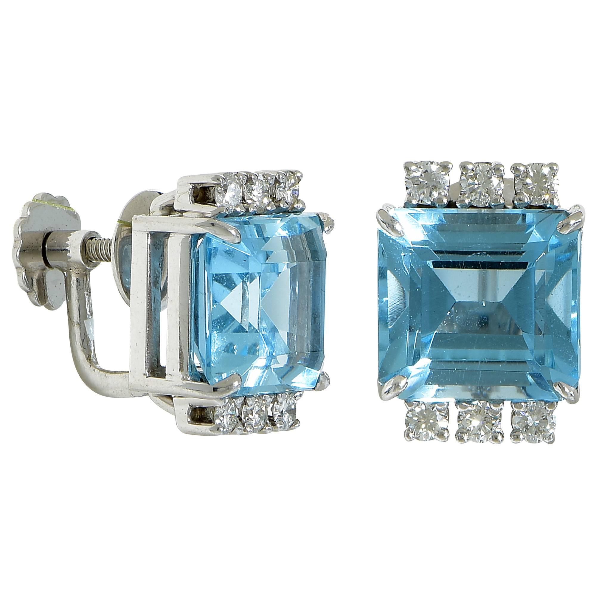 White Gold Earrings Featuring 2 Aquamarines Weighing Approximately 9.00 Carats Accented by .25 Carats of Round Brilliant Cut Diamonds, G Color, VS Clarity.

Measuring: Length 1/2 inch x Width 7/16 inch x Depth 5/16 inch
Weight: 6.37 grams

This