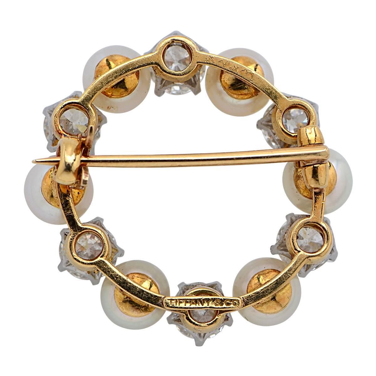 18 Karat Yellow Gold & Natural Pearl Vintage Tiffany & Co. Brooch Featuring 6 Old European Cut Diamonds Weighing Approximately 2.00 Carats, G Color, VS Clarity.

Measurements: 1