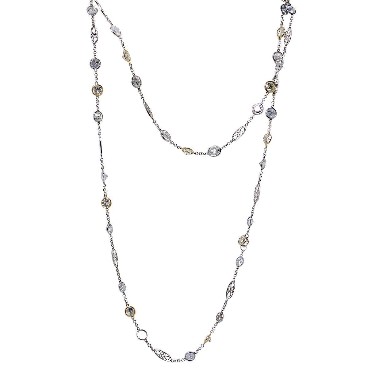 Stunning Diamonds by the Yard necklace crafted in platinum, featuring 54 round brilliant cut white and yellow diamonds weighing approximately 35.35 carats total, SI-I clarity. This Jazz Diva inspired necklace measures 42 inches length and weighs