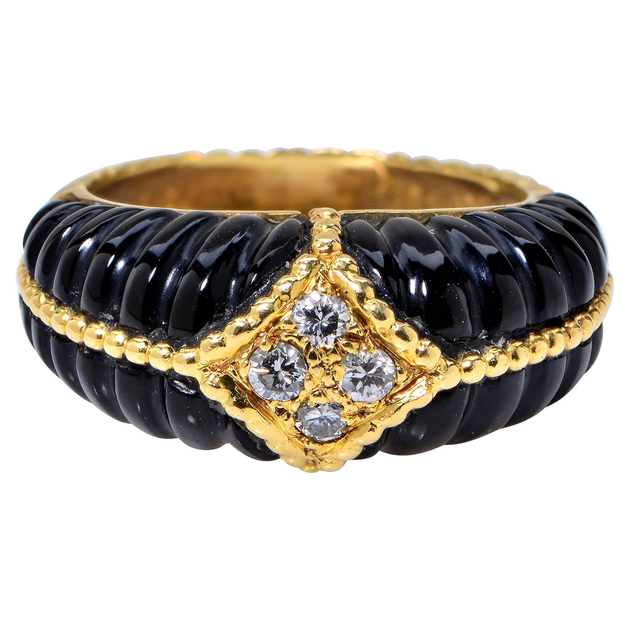 Van Cleef and Arpels 18 Karat Yellow Gold Onyx and Diamond Ring Featuring Four Round Brilliant Cut Diamonds with an Estimated Total Weight of .20 Carats.

Ring Size: 5.5

This Ring is Accompanied by a Retail Appraisal Performed by an Accredited