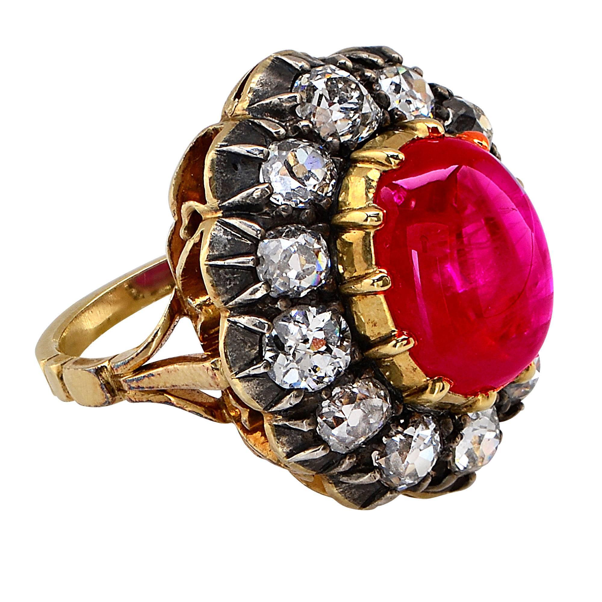 18 Karat Yellow Gold Ruby and Diamond Ring Featuring a 12.84 Carat Heated Burma Cabochon Ruby Surrounded by 12 Old European Cut Diamonds with an Estimated Total Weight of 4 Carats.

Ring Size: 6.25

This Ruby Ring is Accompanied by a GIA Report
