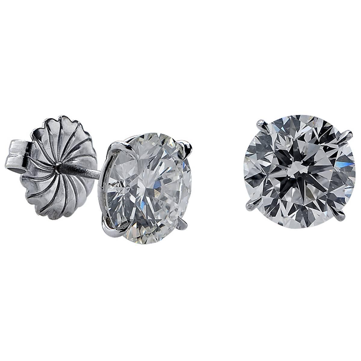 Beautiful platinum solitaire stud earrings featuring two bright and lively very well matched GIA graded round brilliant cut diamonds weighing 7.38cts total weight, L color, VS clarity.

The earrings are stamped and/or tested as platinum.
The metal