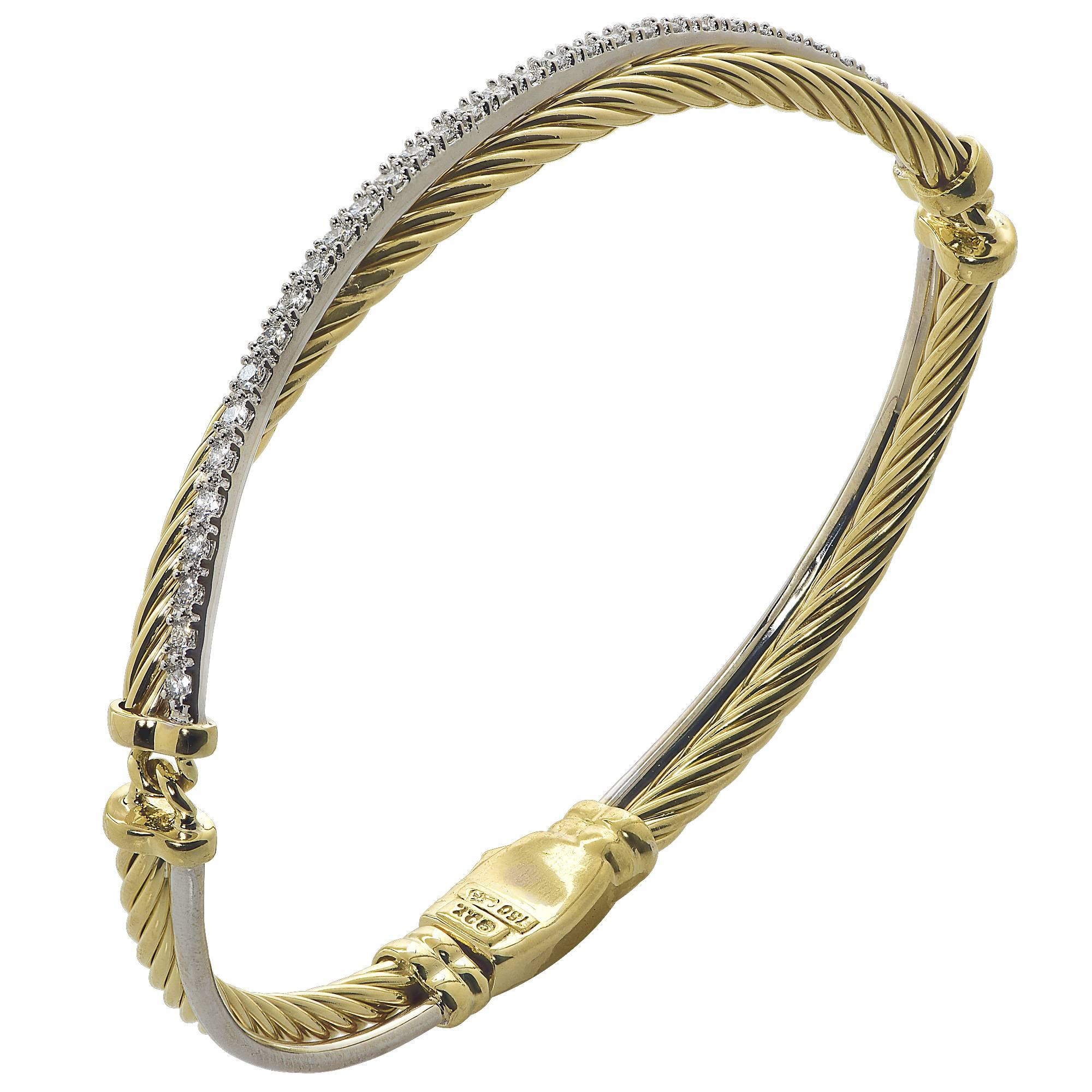18 Karat White and Yellow Gold David Yurman Bangle Featuring .50 Carats of Round Brilliant Cut Diamonds, G Color, VS Clarity.

Weight: 14.46 grams

This Bracelet is Accompanied by a Retail Appraisal Performed by an Accredited Gemologist.