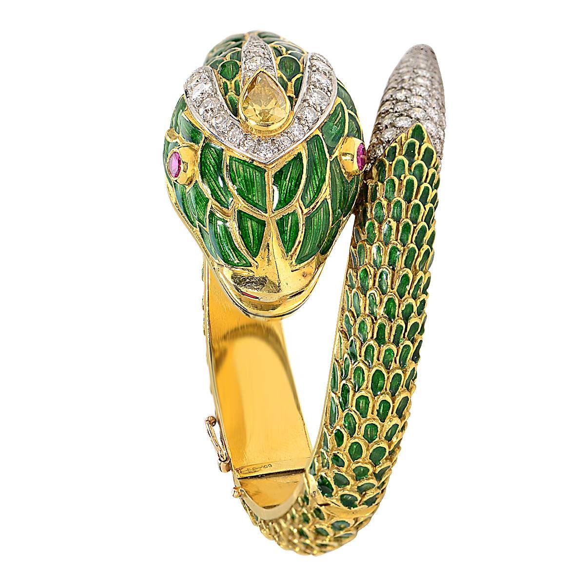 18 Karat Yellow Gold and Platinum Vintage Enamel Snake Bracelet Featuring 4.60 Carats of Round Brilliant Cut Diamonds, G Color, VS Clarity, and a .40 Carat Pear Shape Fancy Yellow Diamond.

Weight: 117.40 grams

This Bracelet is Accompanied by a