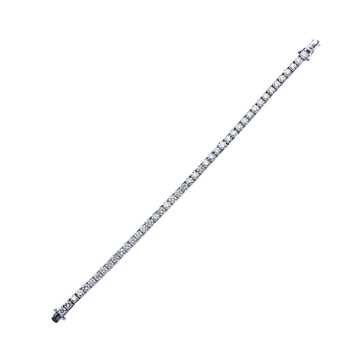 18 Karat White Gold Tennis Bracelet Featuring 49 Round Brilliant Cut Diamonds Weighing 7.47 Carats Total, G Color, VS Clarity.

Measurement: 6.75 inch Length
Weight: 11.66 grams

This Bracelet is Accompanied by a Retail Appraisal Performed by