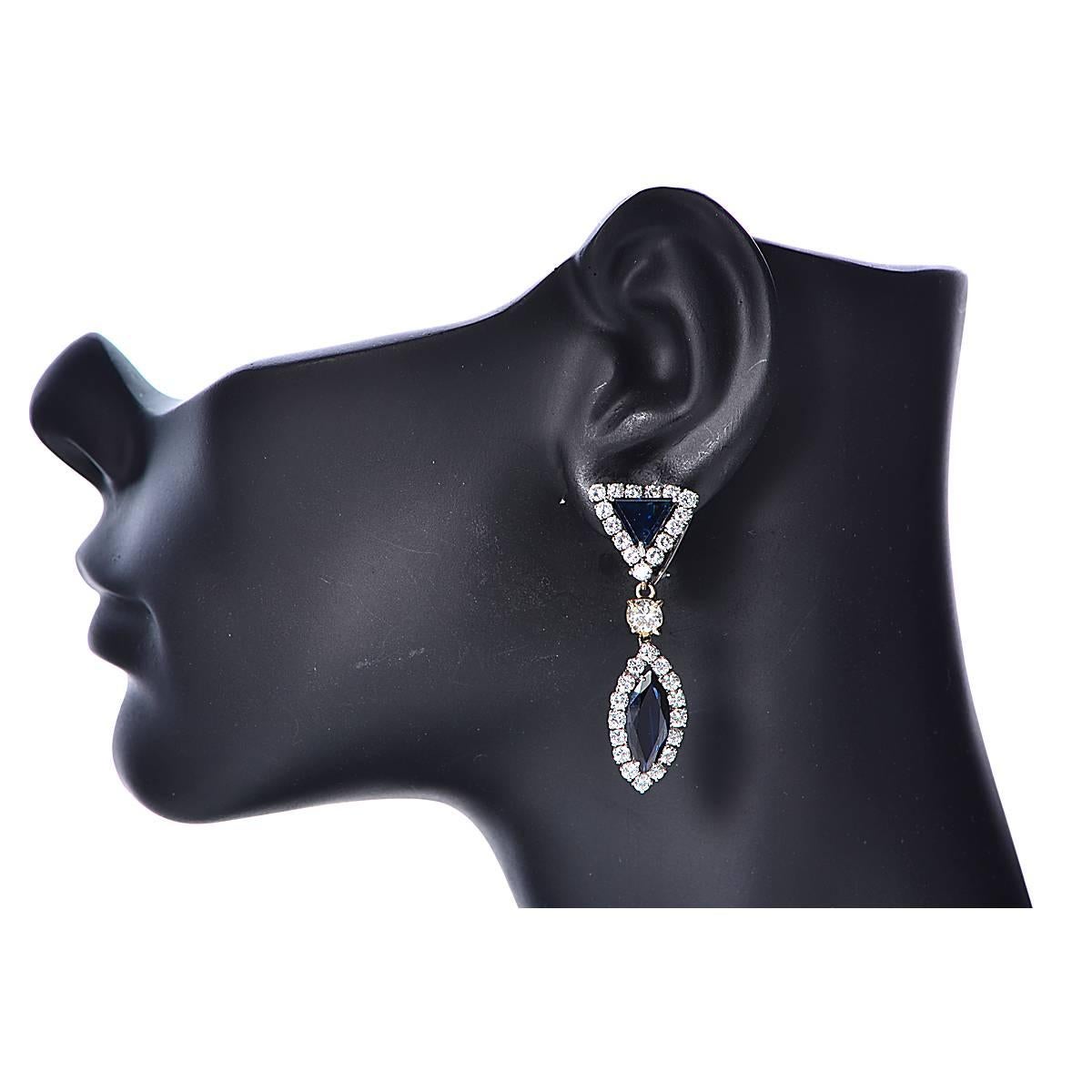 18 Karat White Gold Earrings Featuring 4 Sapphires Weighing Approximately 11.00 Carats Total Accented by 5.90 Carats of Round Brilliant Cut Diamonds, G Color, VS Clarity.

Weight: 16.63 grams

These Earrings are Accompanied by a Retail Appraisal