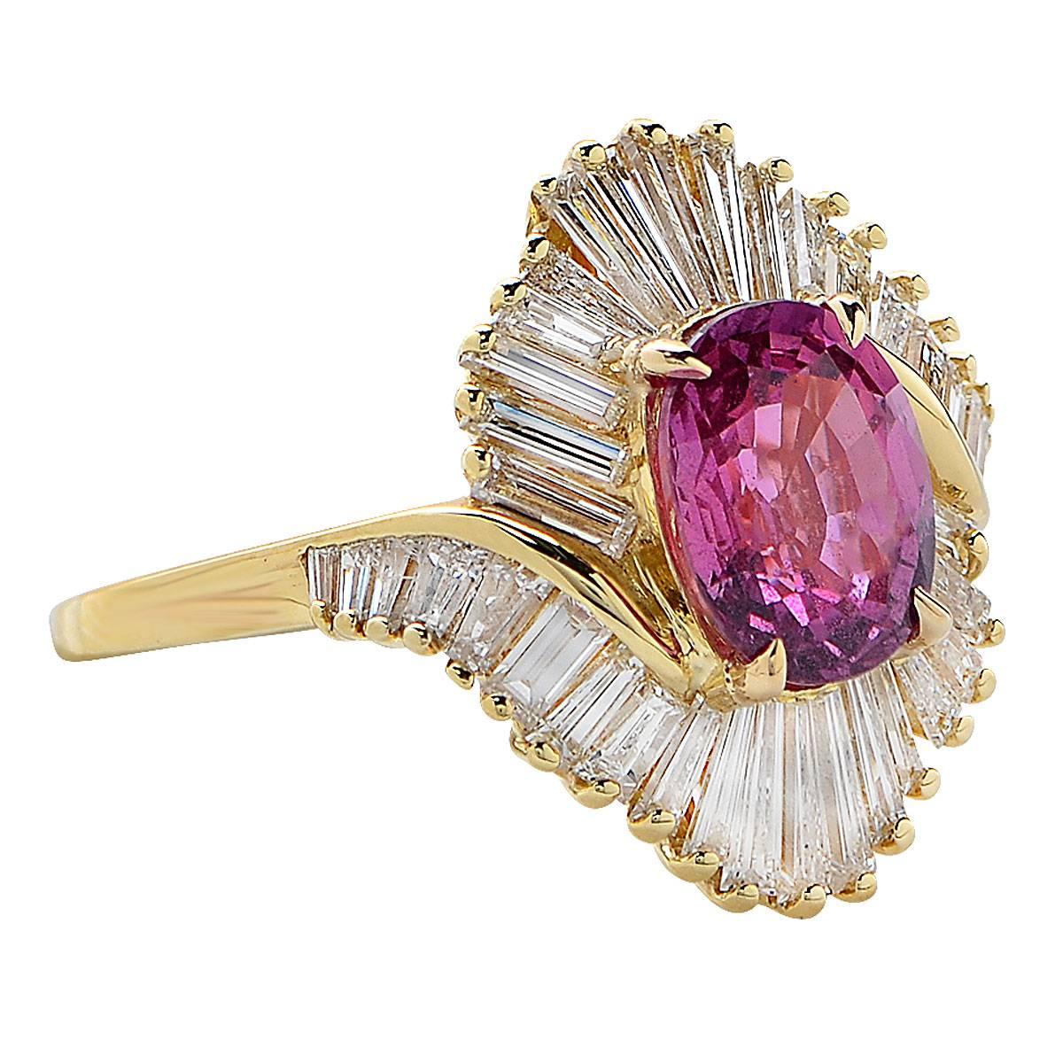 18k yellow gold ring featuring a natural pink sapphire weighing 2.62cts and accented by 38 baguette cut diamonds weighing approximately 2.50cts, G-H color, VS clarity.

Ring size: 5.5
Weight: 13.68 grams

This sapphire and diamond ring is