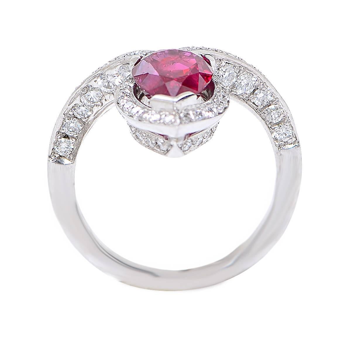 Platinum ring featuring a 2.21ct pear shape cut natural ruby accented by 72 round brilliant cut diamonds.

Metal weight: 7.85 grams

This ruby and diamond ring is accompanied by a retail appraisal performed by a Graduate Gemologist.