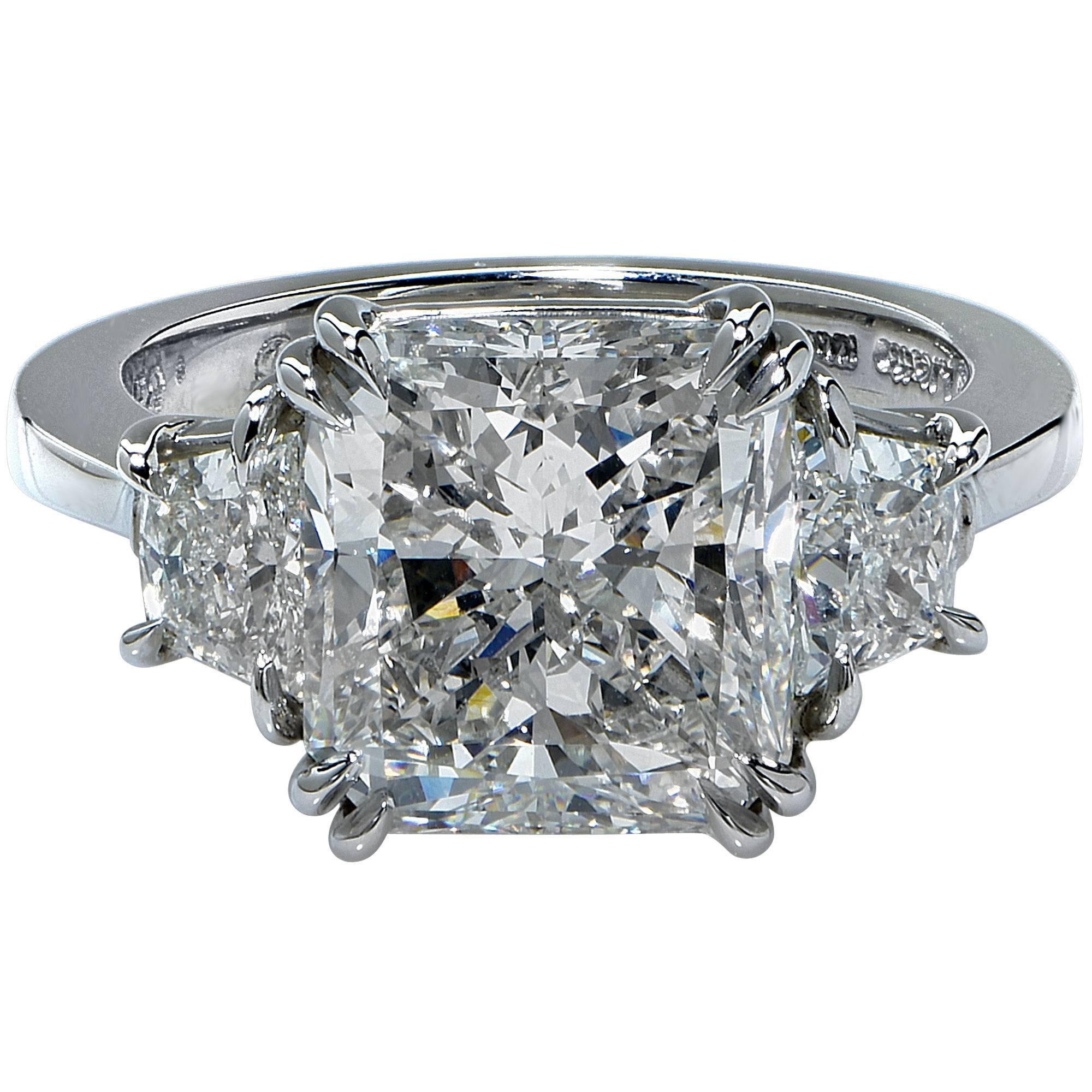 5.06ct J/VS2 clarity GIA radiant cut flanked by 2 trapezoids weighing .85cts, I color, VS clarity, set in a platinum hand made ring.

Ring size: 6.5 (can be re-sized up or down)

This diamond ring is accompanied by a GIA report as well as a retail
