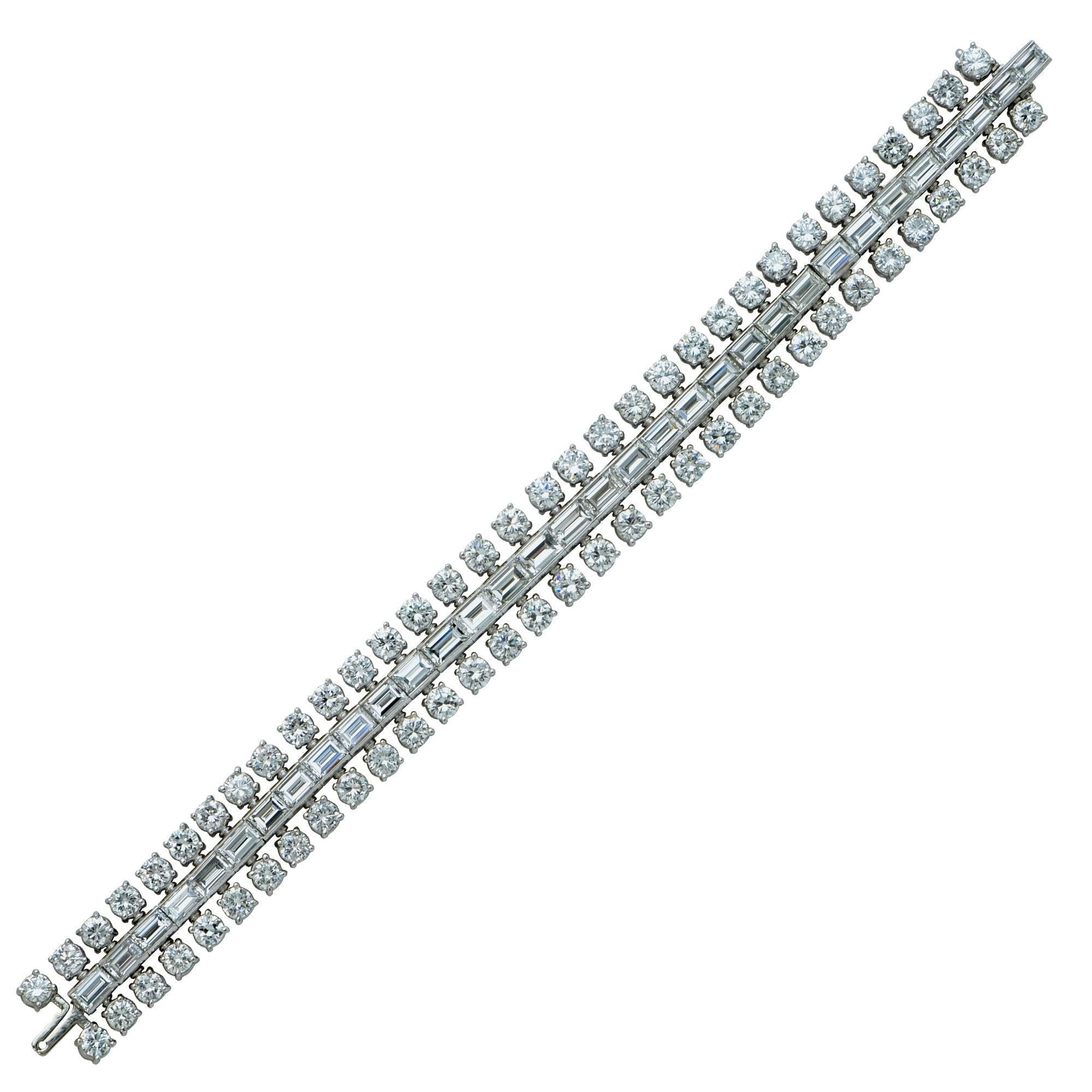 Platinum hand made bracelet containing 66 round brilliant cut diamonds weighing approximately 19.50cts F color VS clarity and 33 step cut diamonds weighing approximately 13.50cts F Color VS clarity - Circa 1950's.

Measurement: 7 inch