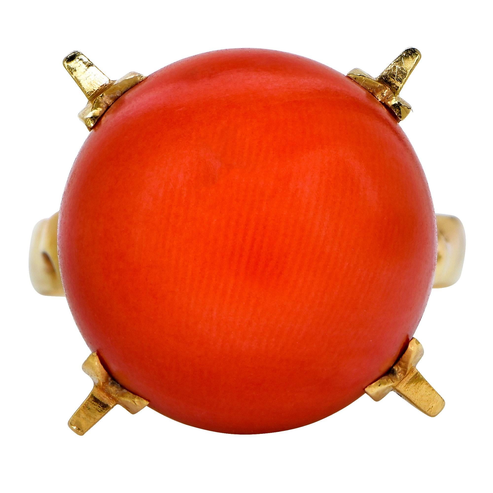 18k yellow gold ring featuring a 15mm round piece of red coral.

Ring size: 6.5

This coral ring is accompanied by a retail appraisal performed by a Graduate Gemologist.