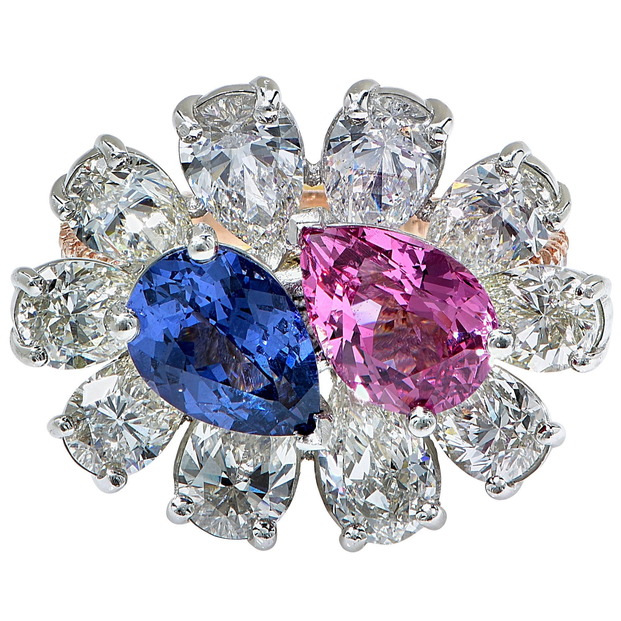 18k white and rose gold ring containing a blue and a pink spinel weighing approximately 3.50ct Total, surrounded by 10 pear shape diamonds weighing approximately 4.50cts.

Ring size: 6 (can be sized up or down free of charge)
Metal weight: 11.42