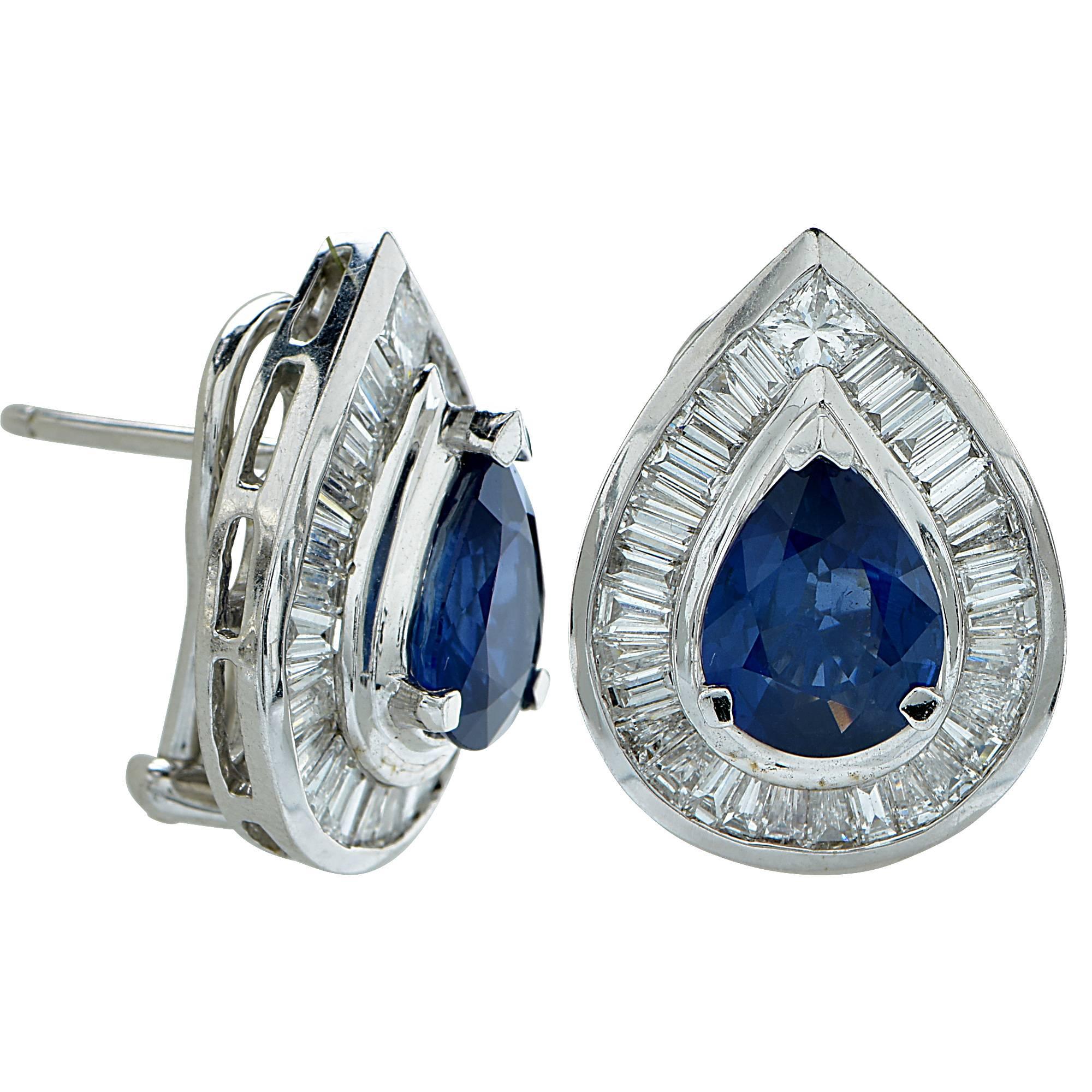 18k white gold earrings featuring two pear shape cut sapphires weighing approximately 4cts total surrounded by 66 mixed cut diamonds weighing approximately 2.20cts total, G color, VS clarity.

Metal weight: 10.10 grams

These sapphire and