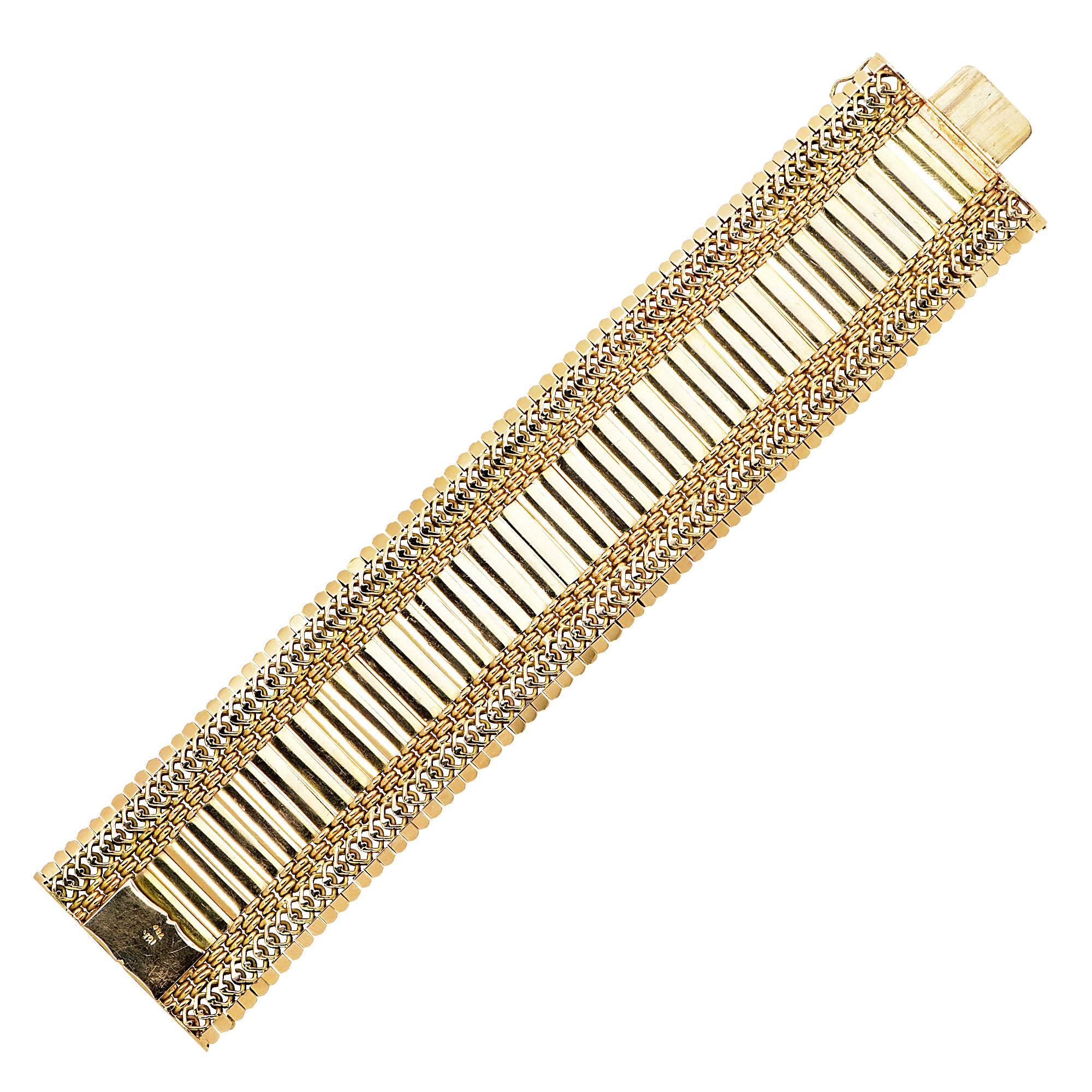 18k rose gold retro bracelet.

Metal weight: 101.54 grams

This bracelet is accompanied by a retail appraisal performed by a Graduate Gemologist.