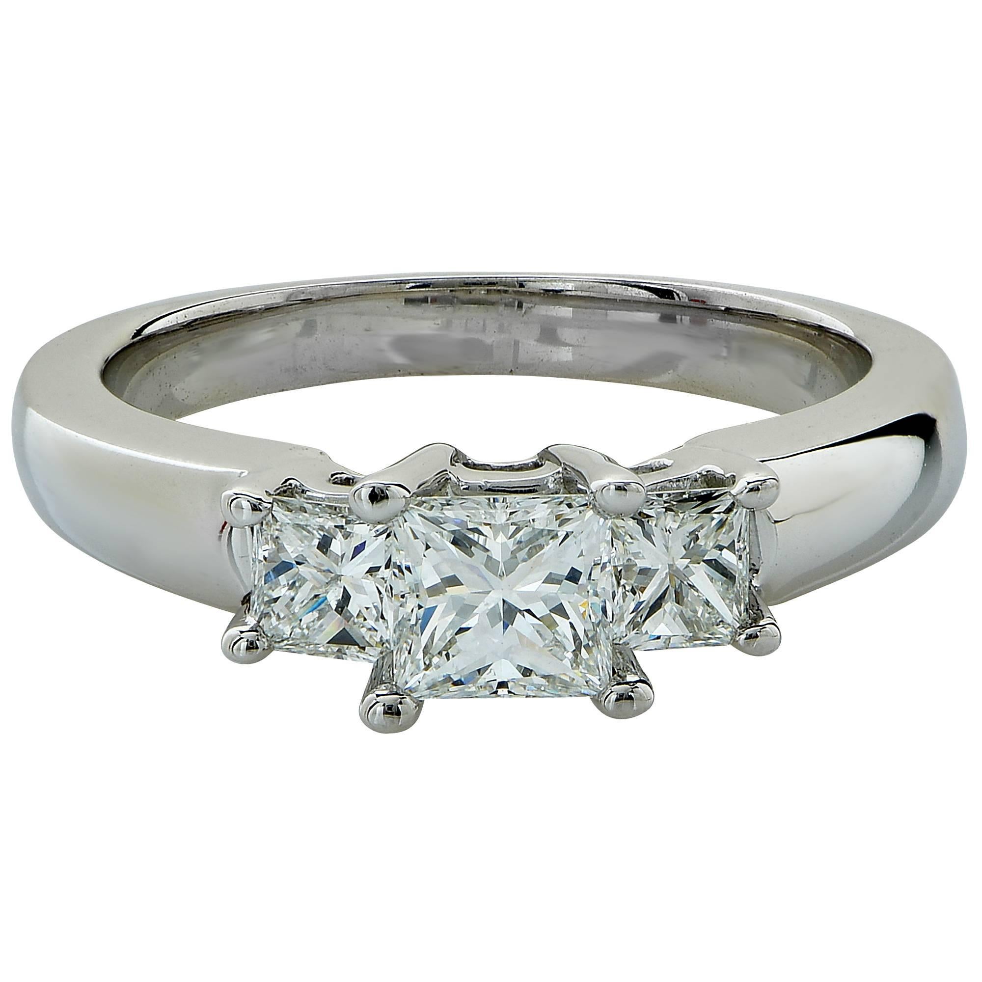 18k white gold birks ring featuring 3 princess cut diamonds weighing approximately 1.10cts total, F-G color, VS clarity.

Ring size: 6 (can be sized up or down free of charge)
Metal weight: 8.00 grams

This diamond ring is accompanied by a