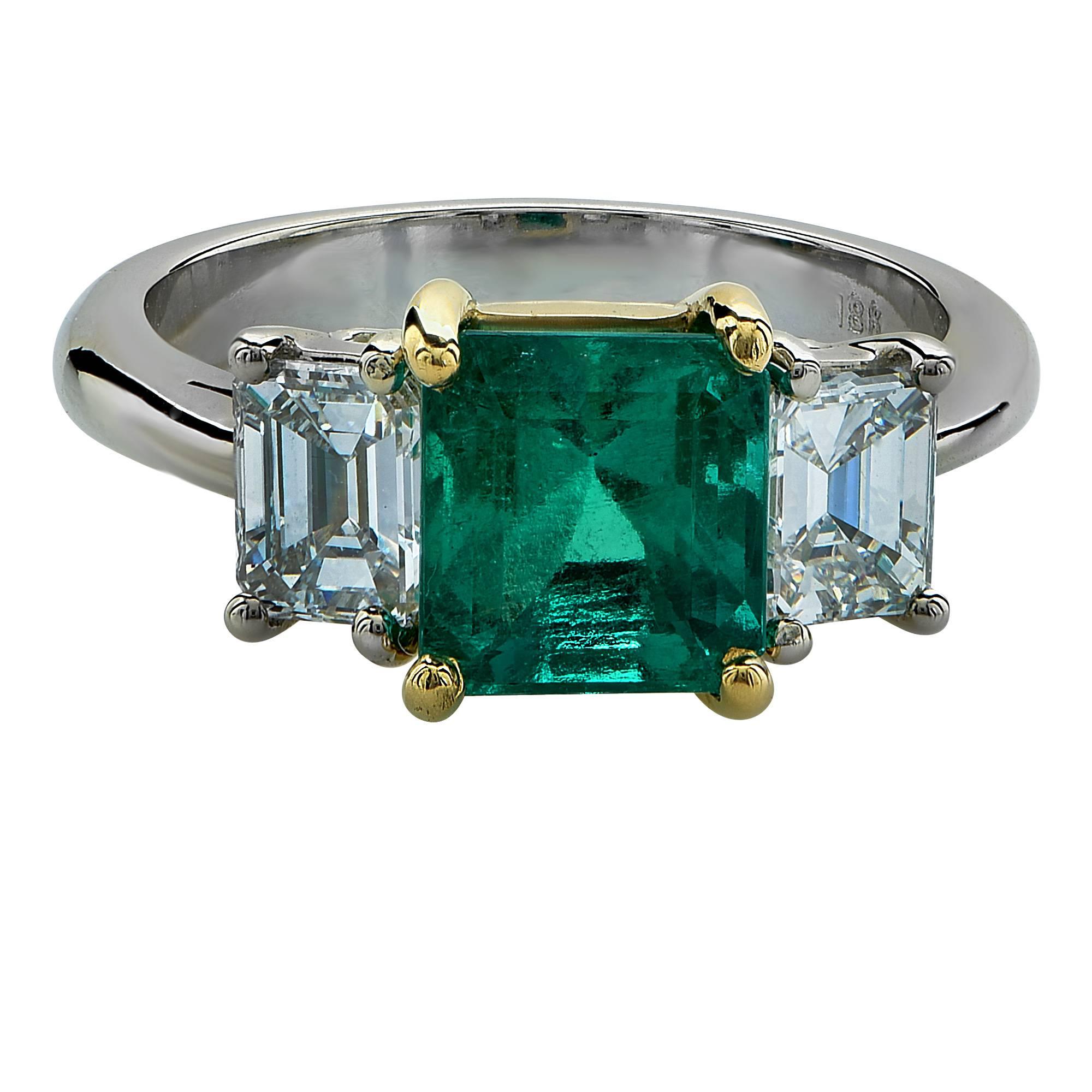 This stunning emerald and diamond ring features a 2.13ct GIA graded emerald accented by two gorgeous emerald cut diamonds weighting 1.05cts total, F color, VS1 clarity.

Ring size: 6 (can be sized up or down free of charge)
Metal weight: 5.28