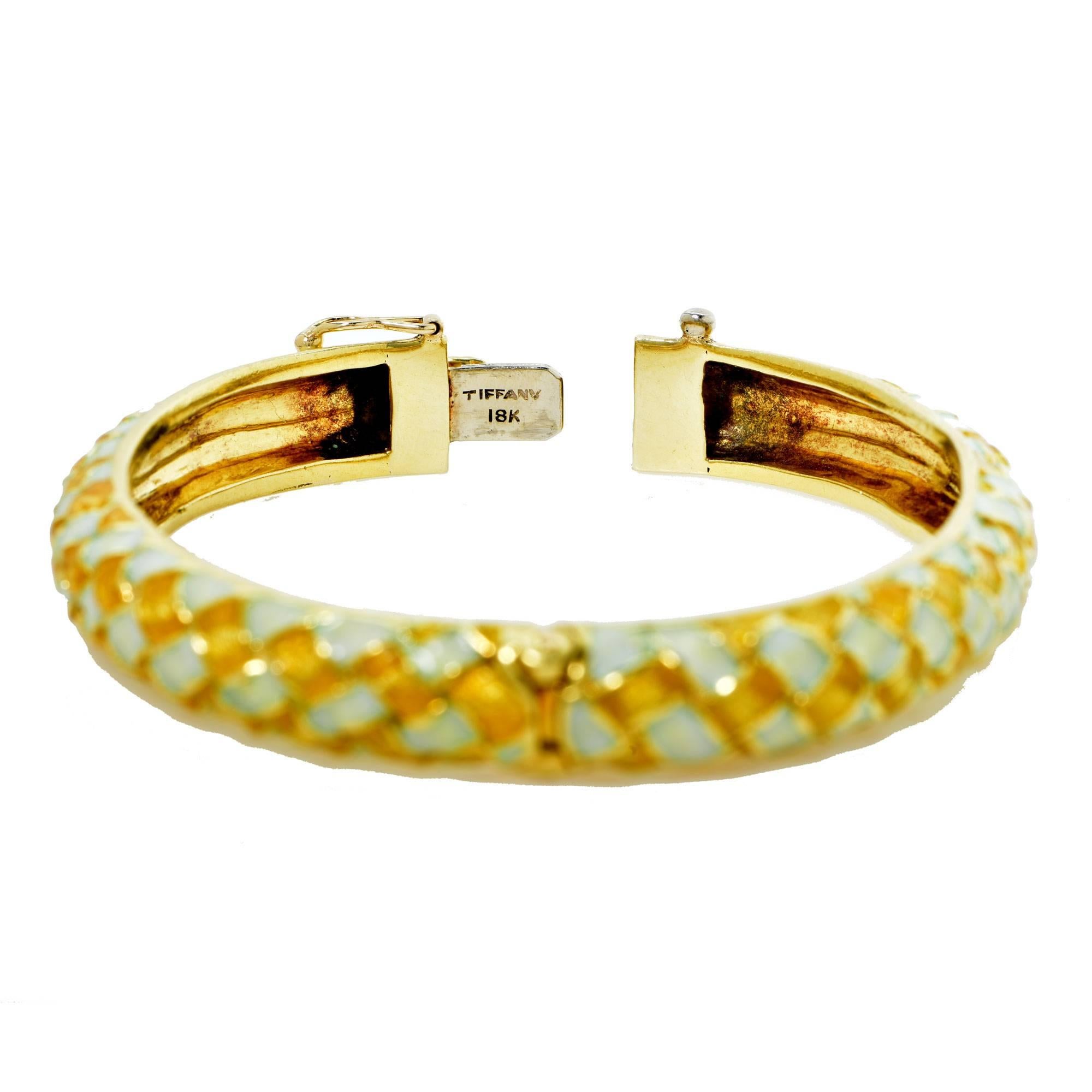 18k yellow gold Tiffany & Co Enamel Bangle.

Metal weight: 51.00 grams

This bangle bracelet is accompanied by a retail appraisal performed by a GIA Graduate Gemologist.