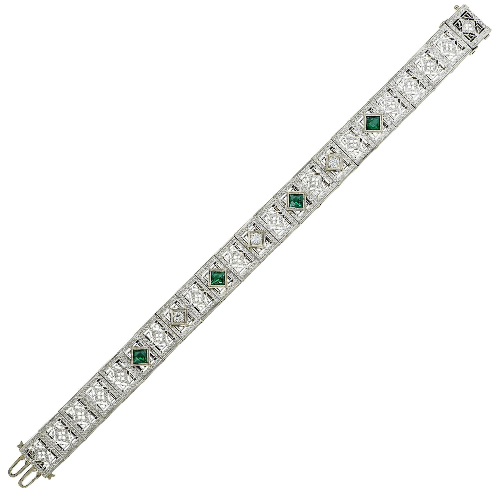Platinum and 14k white gold bracelet featuring 3 old European cut diamonds weighing approximately .50cts total, G color VS clarity, accented by 4 square cut green gemstones.

Metal weight: 19.12 grams

This diamond bracelet is accompanied by a