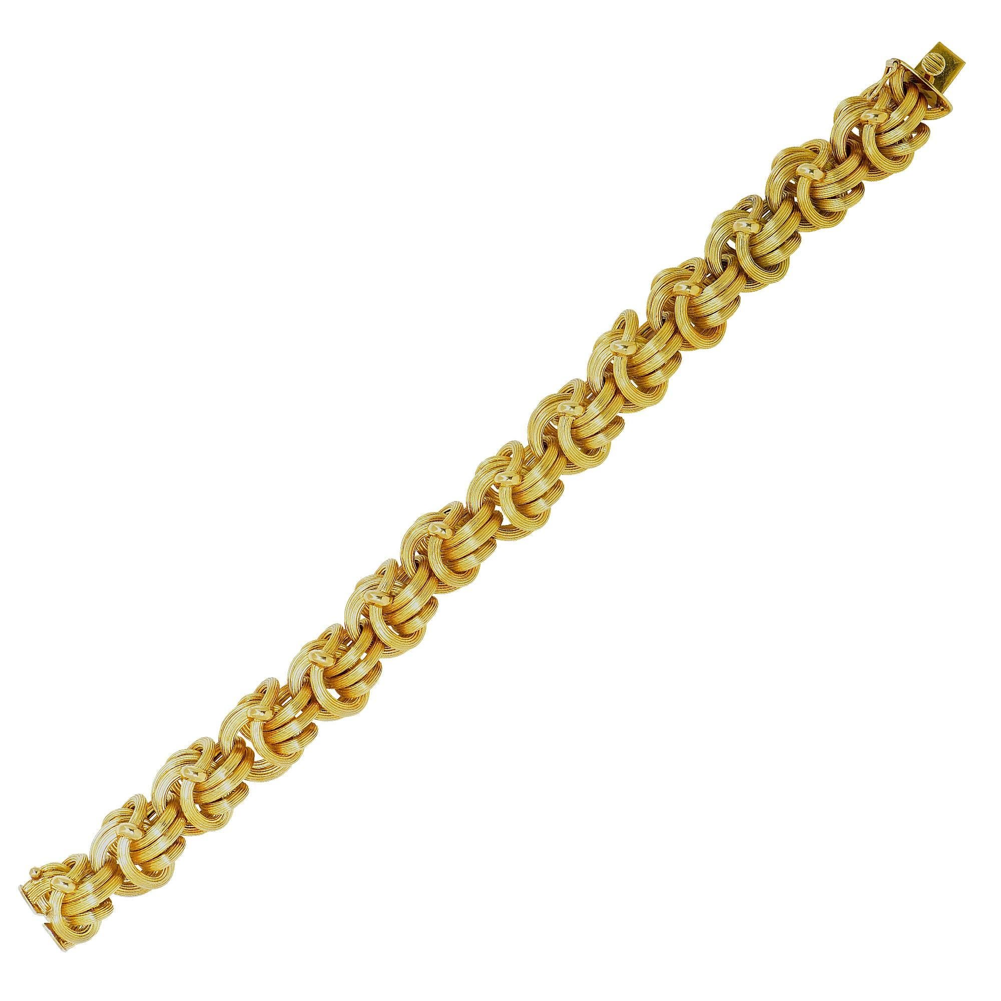 18k yellow gold wove bracelet, made in Italy.

Metal weight: 37.94 grams

This gold bracelet is accompanied by a retail appraisal performed by a GIA Graduate Gemologist.
