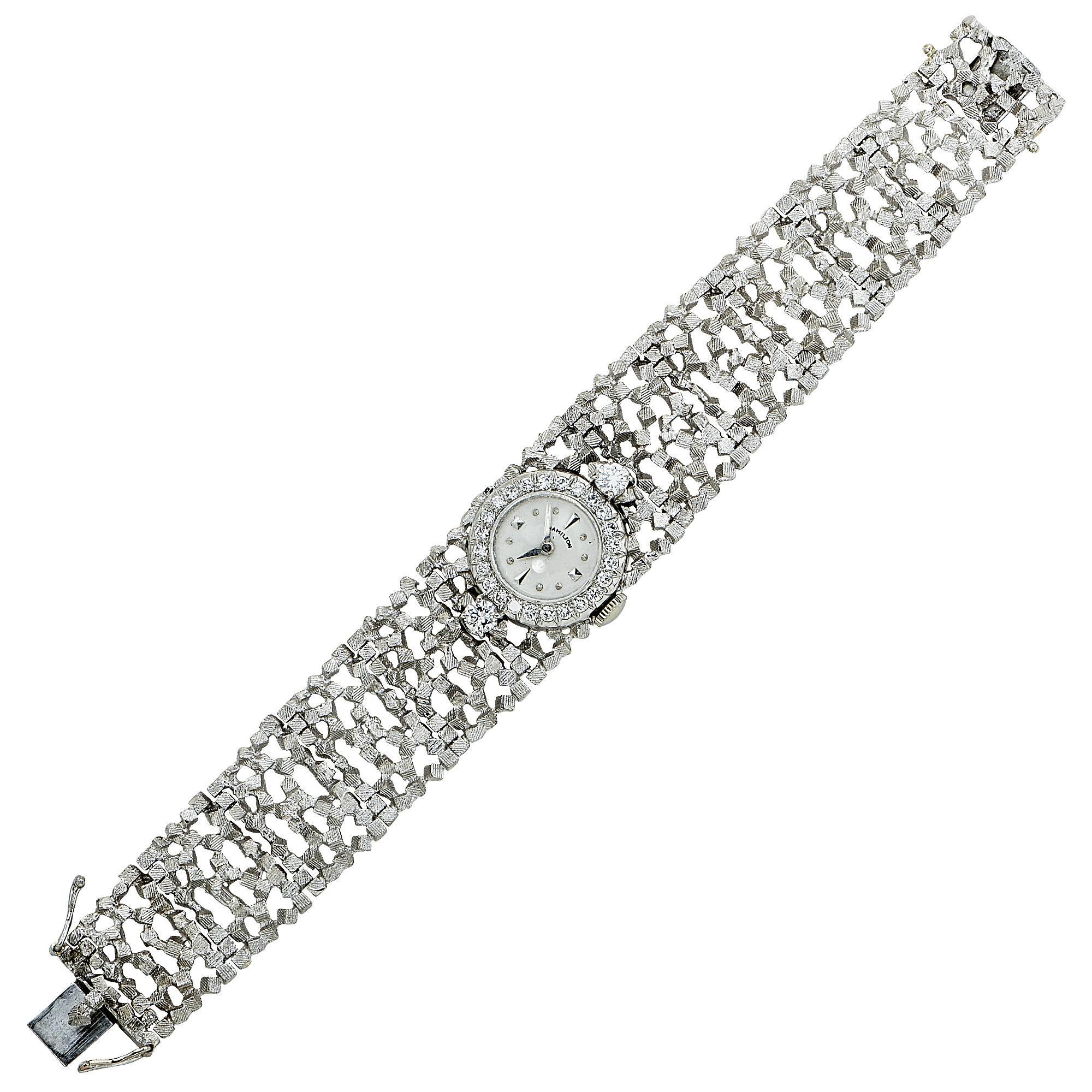 Platinum and 18k white gold John Donald, Hamilton watch, featuring 26 round brilliant cut diamonds weighing approximately 1.1cts total, G color VS clarity. 

Metal weight: 42.60 grams

This diamond ring is accompanied by a retail appraisal