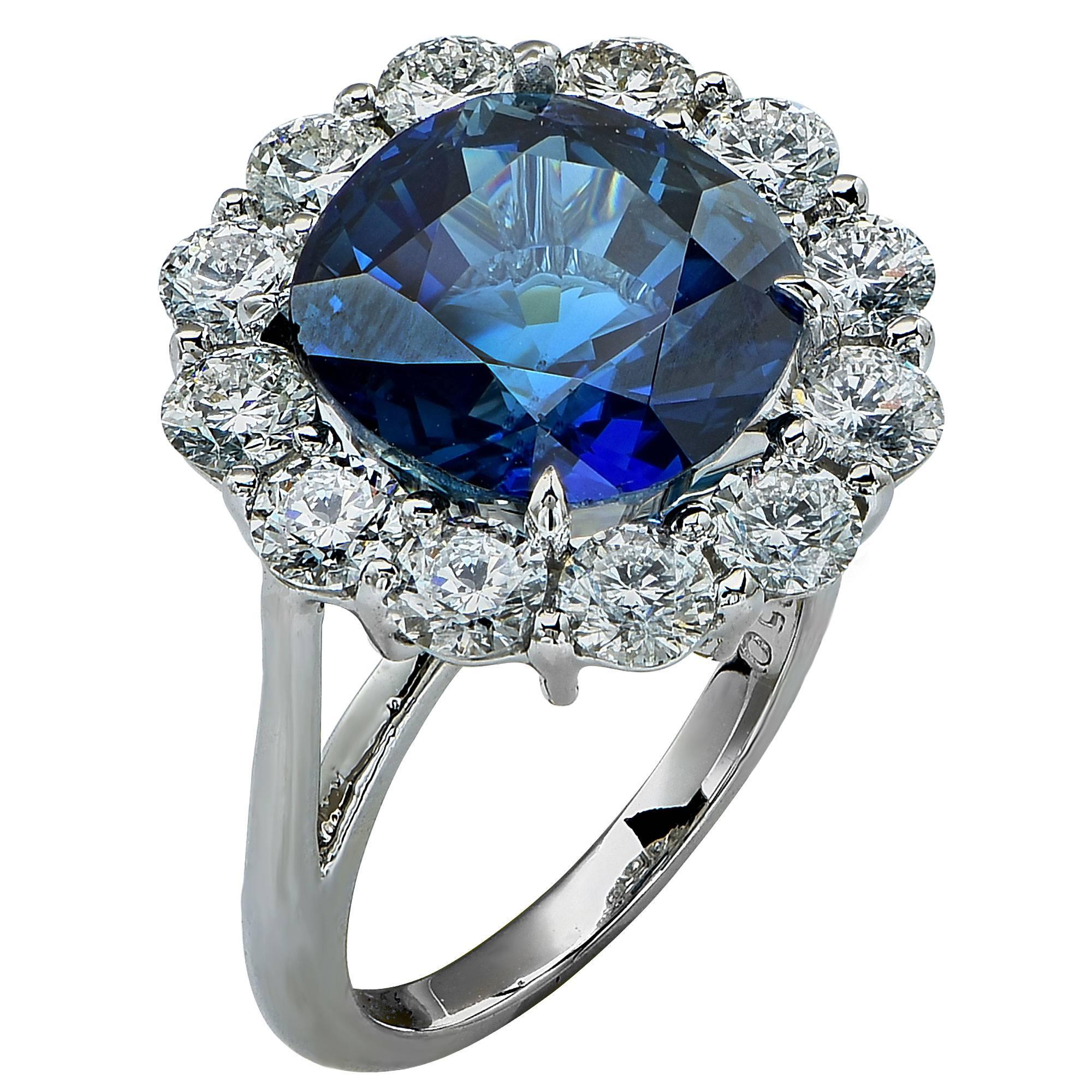 Platinum hand made ring containing a 10.32ct Cushion cut unheated sapphire surrounded by 12 Round brilliant cut diamonds weighing approximately 3cts F color and VS clarity.

Ring size: 6 (can be sized up or down)

The ring is accompanied by a