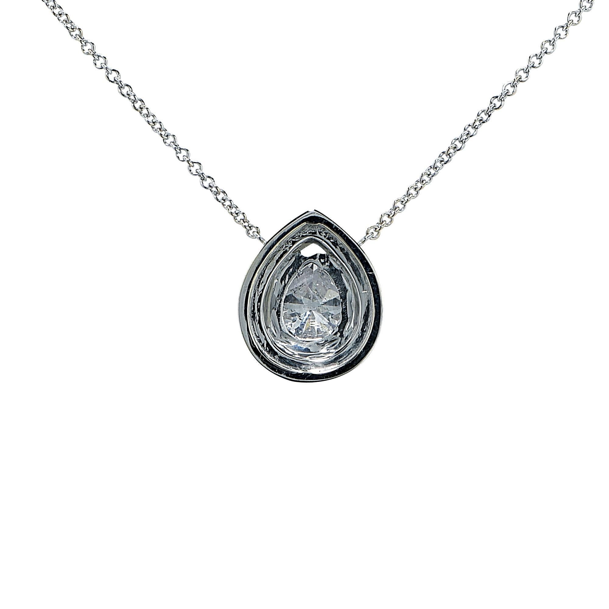 18k white gold necklace featuring a 1.12ct pear shape cut diamond G color SI3 clarity accented by 47 round brilliant cut diamonds weighing .32cts total, G color VS clarity.

It is stamped and/or tested as 18k gold.
The metal weight is 3.79