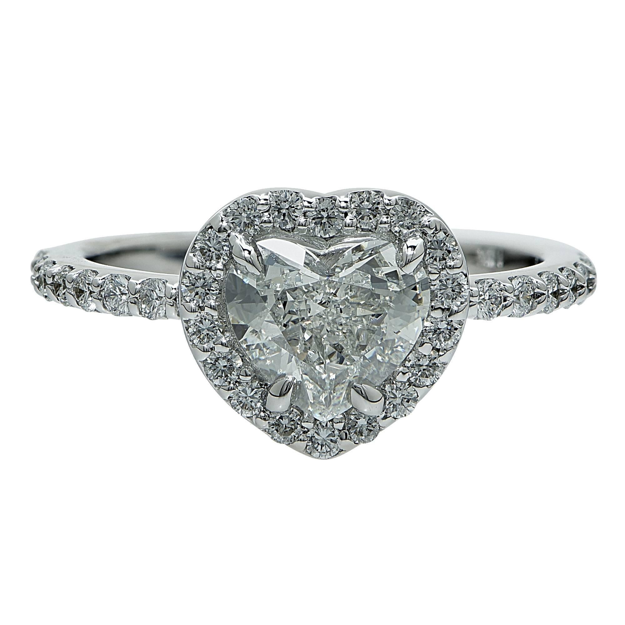 18k white gold hand-crafted ring featuring a GIA graded 1.00ct heart shape cut diamond, H color, SI1 clarity, and accented by 34 round brilliant cut diamonds weighing approximately .50cts, G color, VS clarity.

Ring size: 5.5 (can be sized up or