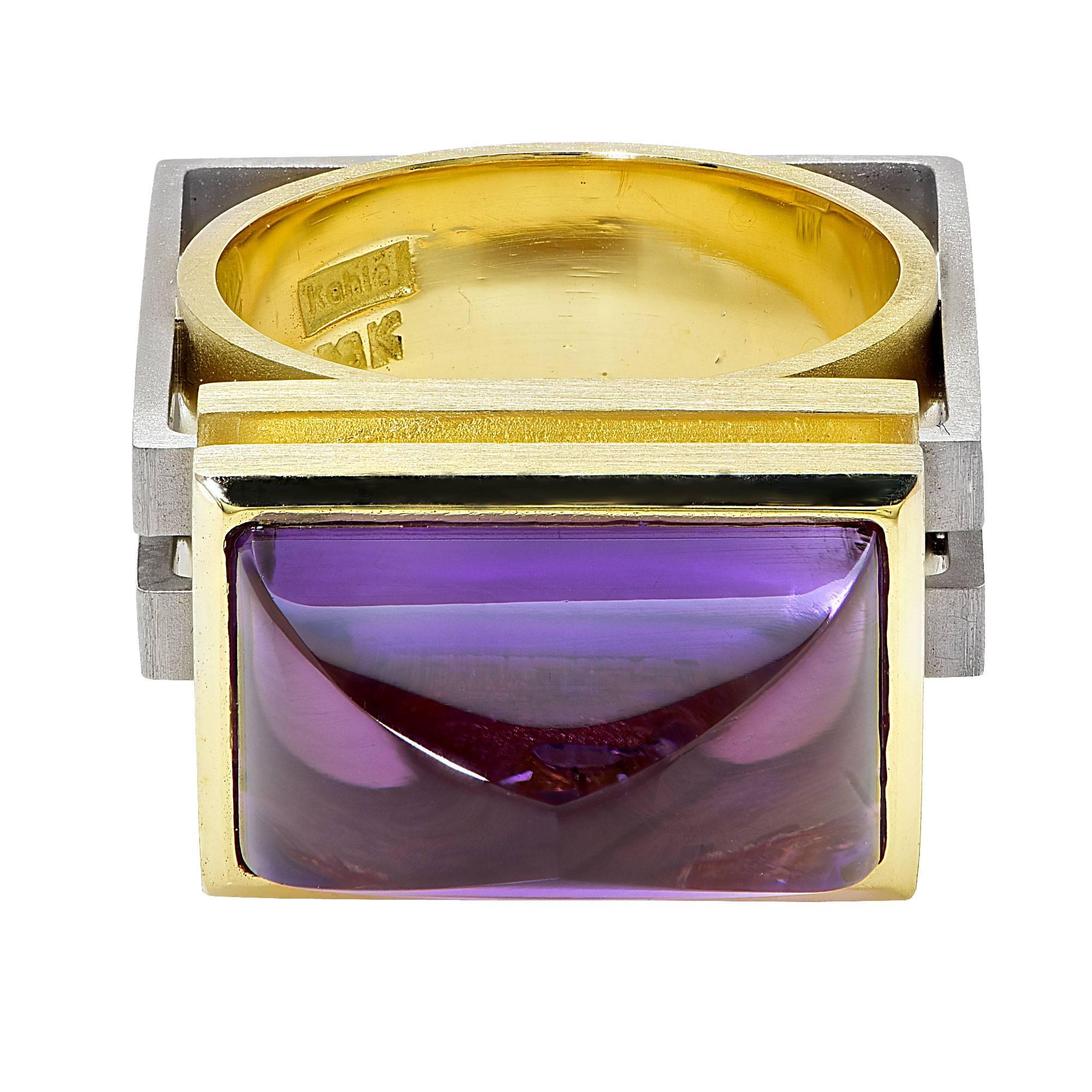 18k white and yellow gold Ruud Kahle ring featuring a cabochon Amethyst weighing approximately 10cts.

Metal weight: 22.56 grams

This amethyst ring is accompanied by a retail appraisal performed by a GIA Graduate Gemologist.