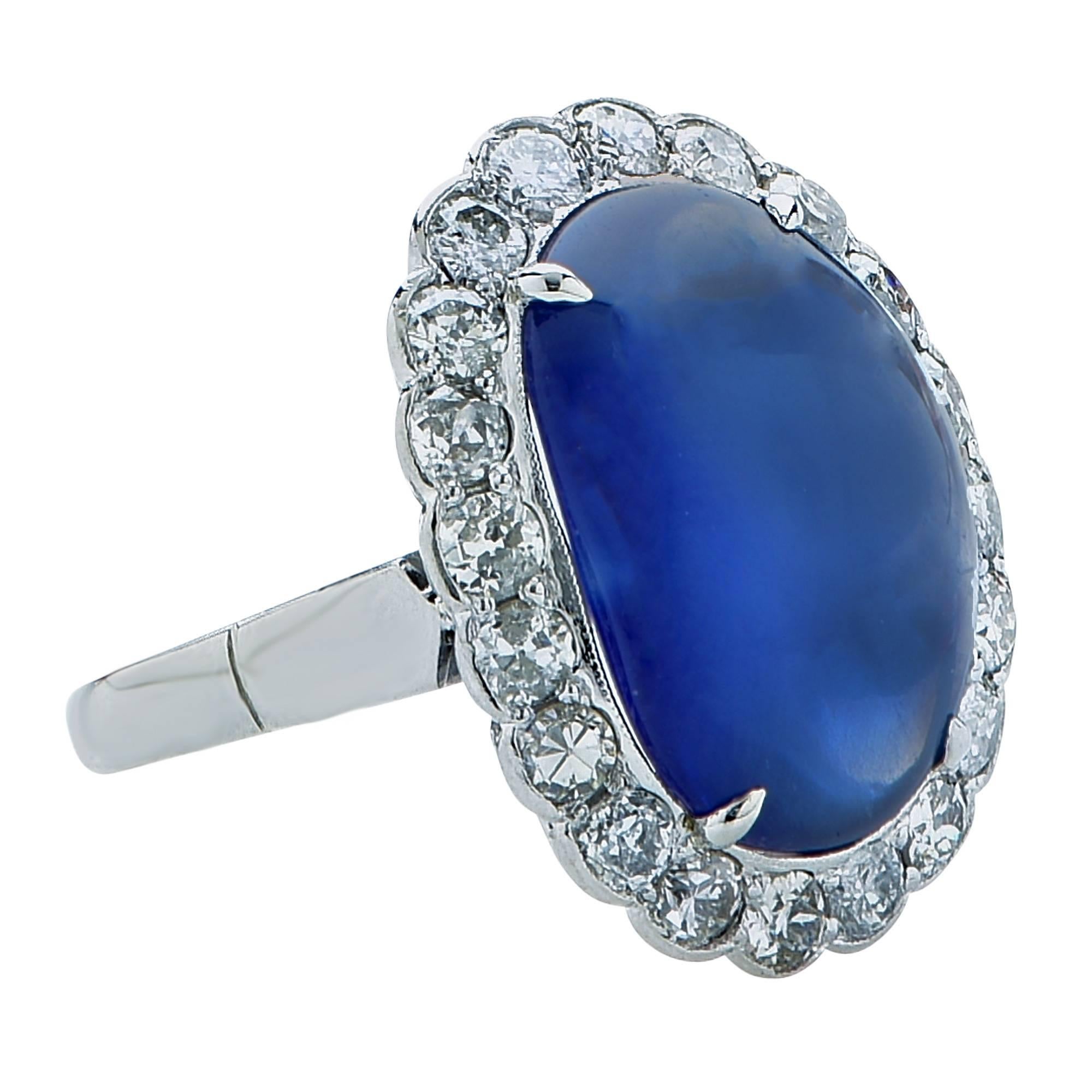 10.20ct unheated Burma sapphire cabochon oval with a royal blue velvety color set in to a platinum ring surrounded by 20 round brilliant cut diamonds.

Ring size: 7 (can be sized up or down)

This sapphire and diamond ring is accompanied by a