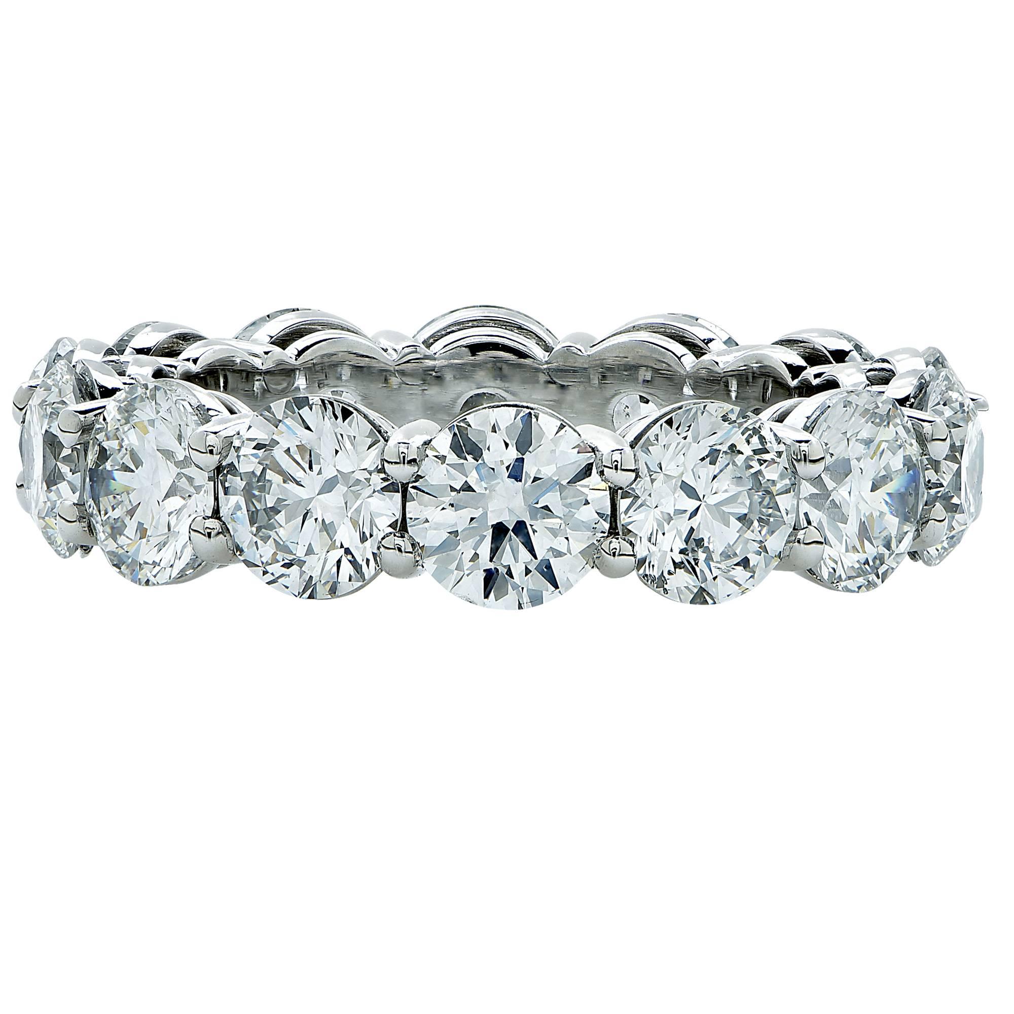 Hand made platinum open gallery shared prong eternity band containing 14 round brilliant cut diamonds weighing 5.62ct D-F color and VS2-SI2 clarity. All diamonds are accompanied by GIA reports.

The ring is a size 6 and can be sized up or