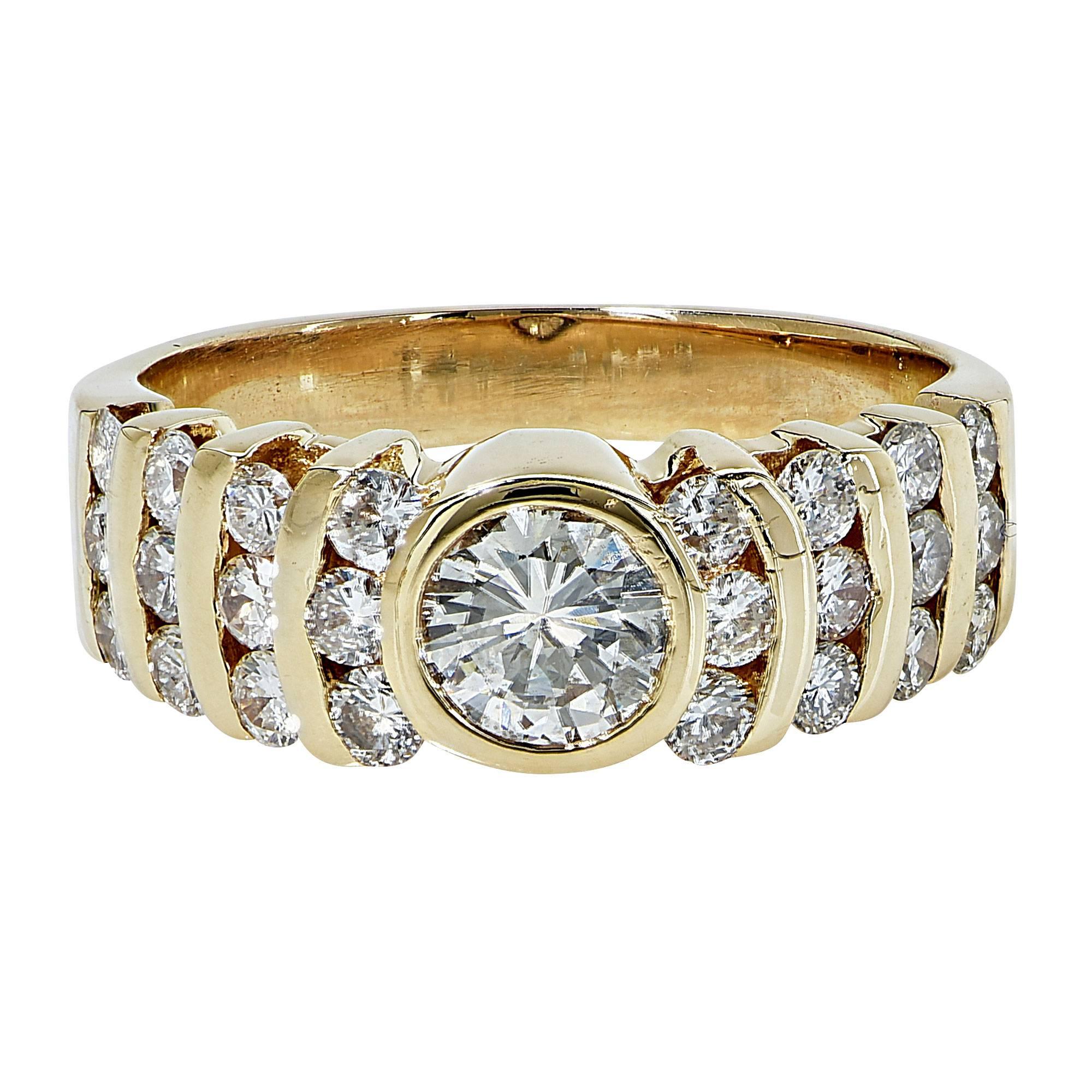 18k yellow gold ring featuring a .50ct round brilliant cut center stone and 24 round brilliant cut diamonds weighing approximately .60cts, G color, VS clarity.

The ring is a size 6 and can be sized up or down.
It is stamped and/or tested as 18k