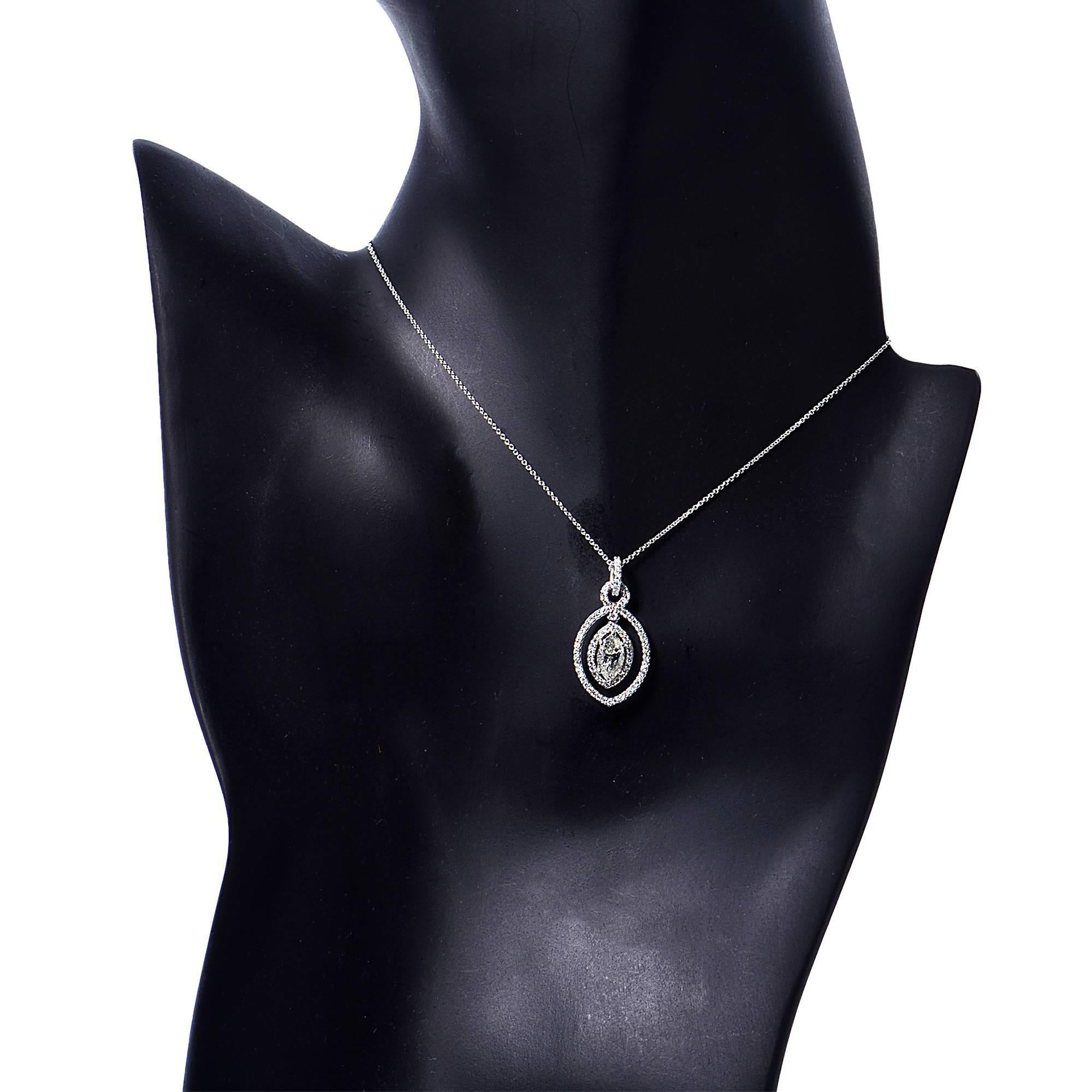 18k white gold necklace and pendant featuring a marquise cut diamond weighing 1.01cts, J color, SI clarity, accented by 93 round brilliant cut diamonds weighing .64cts total, H color, VS clarity.

Metal weight: 3.52 grams

This diamond pendant