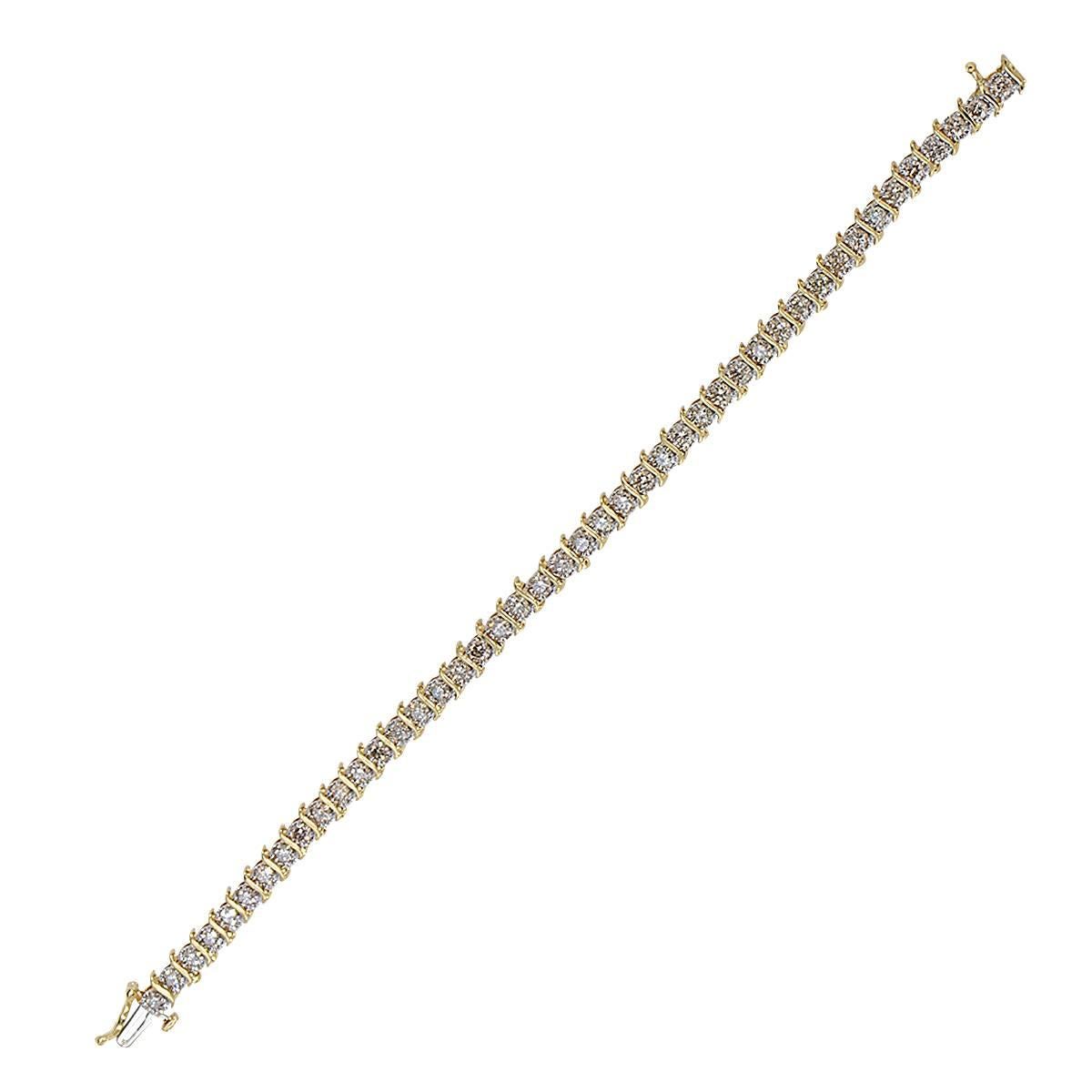 14k yellow gold diamond tennis bracelet containing 44 round brilliant cut diamonds weighing approximately 5cts total, K color, SI clarity.

Metal weight: 11.66 grams

This diamond bracelet is accompanied by a retail appraisal performed by a GIA