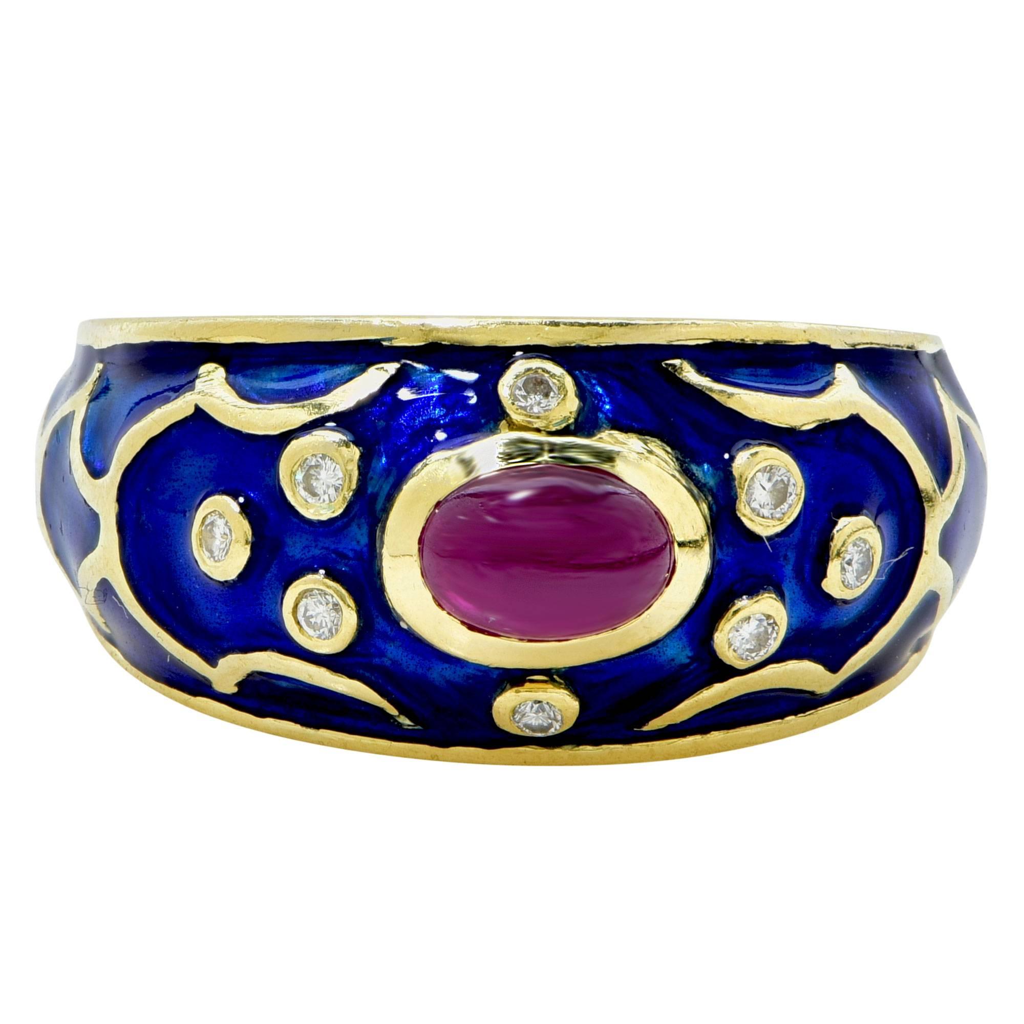 18k yellow gold enamel ring featuring a cabochon ruby accented by 8 round brilliant cut diamonds weighing approximately .10cts total. 

Ring size: 7.5 (can be sized up or down)
Metal weight: 10.10 grams

This ruby and diamond ring is